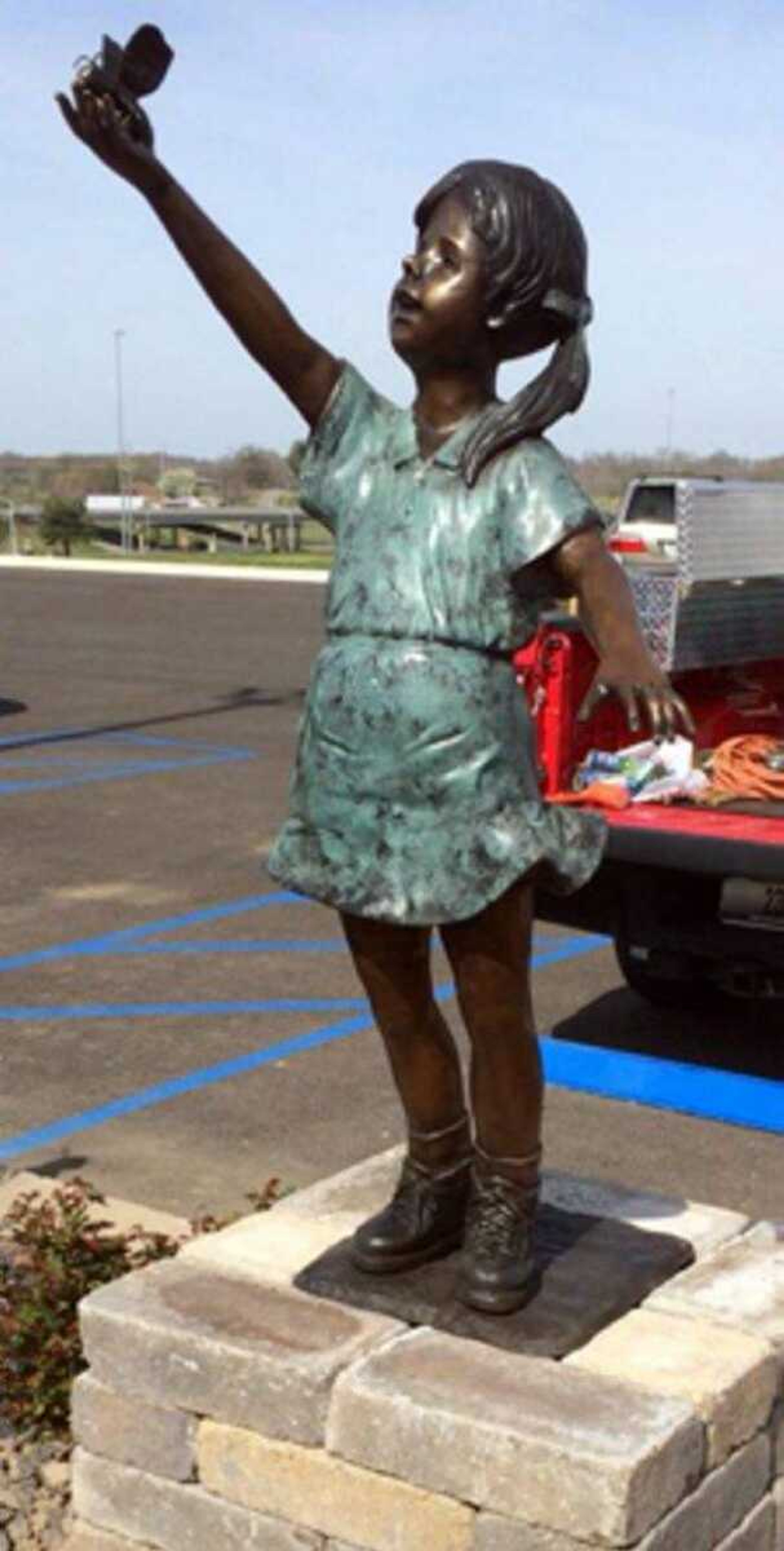 The bronze statue of 3-year-old Melaina Cunningham at Melaina's Magical Playland was found missing Saturday morning.