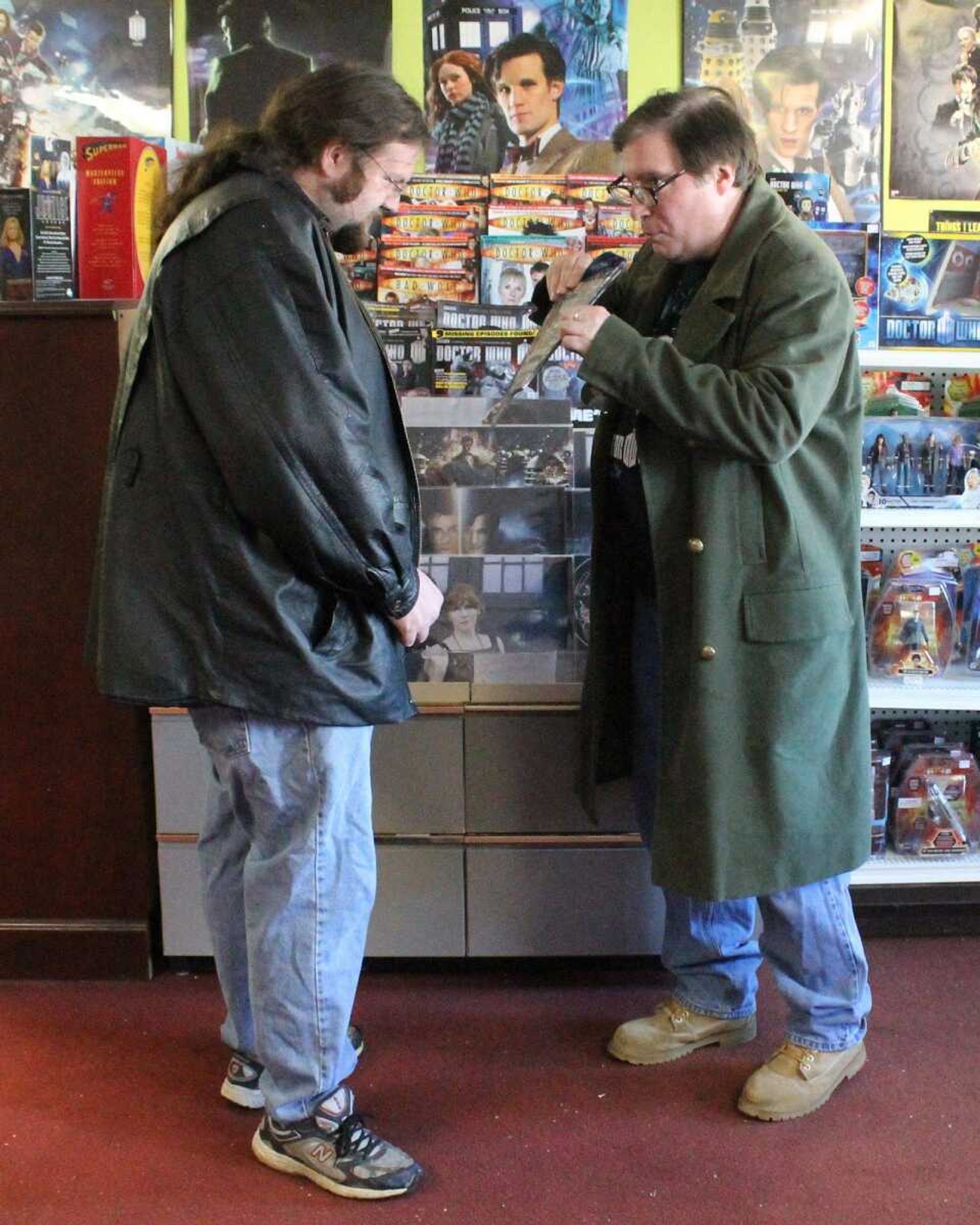 Will "The Doctor of Metropolis" Bruhn, right, discusses a magazine with Scott Lester of Benton, Ky., at Bruhn's store, Daily Star Comics, in Metropolis, Ill.