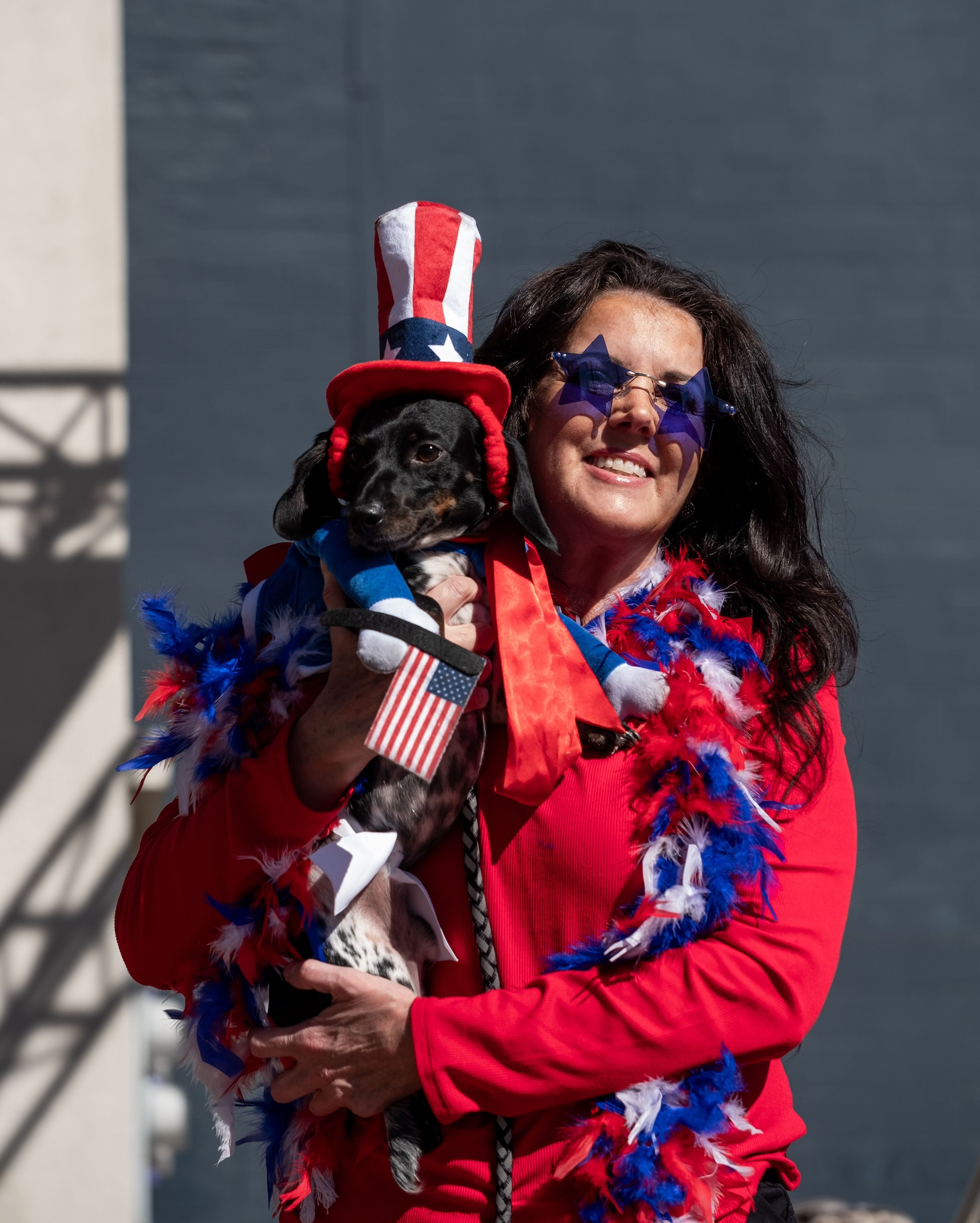 Ashley Sullivan of Cape Girardeau proudly presents her dog, Dallas, in the Dog Dress-Up Contest, where they secured second place.
