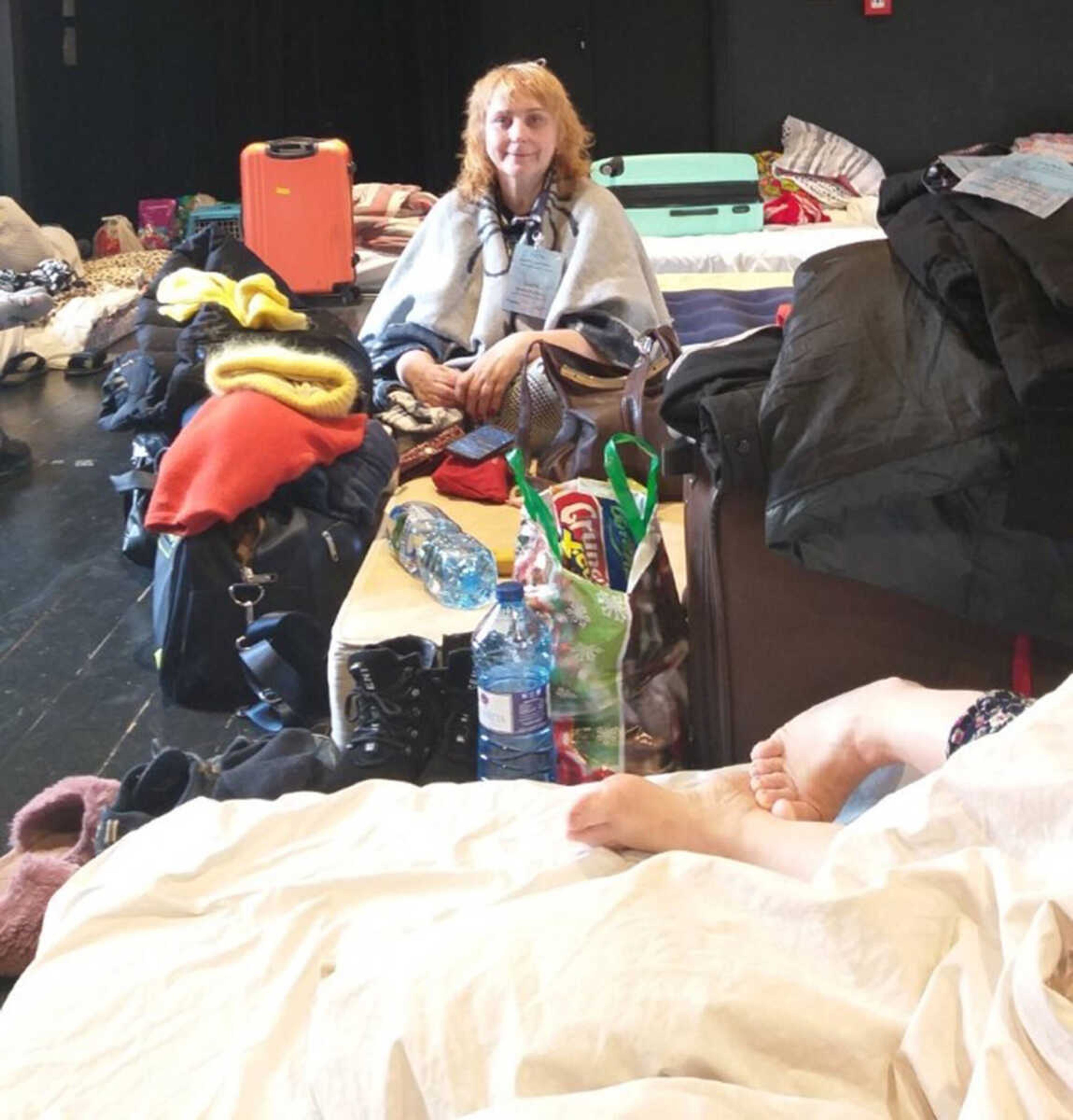 Zoia Ryzhkova rests after arriving at a Ukrainian refugee camp in Krakow, Poland. Soon after, she was shuttled to a private home near the Carpathian mountains to stay with other refugees.