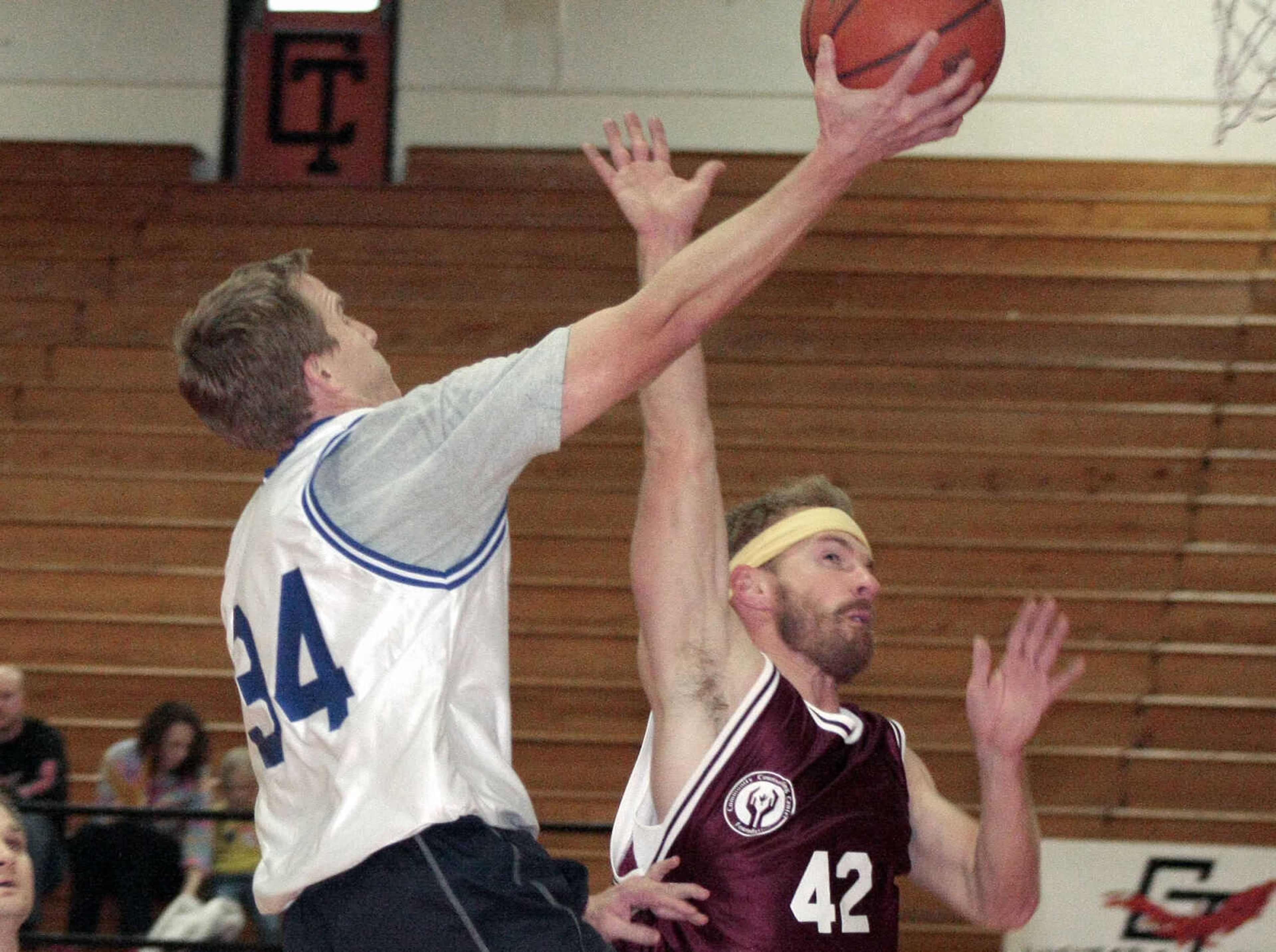 JONATHAN BRIDGES ~ photos@semissourian.com
Dr. Nathan McGuire takes a shot over David Wiegert Saturday, March 3, 3012 during the 19th annual Doctors vs. Lawyers basketball showdown at Cape Central Junior High School in Cape Girardeau. Doctors won 84-70.