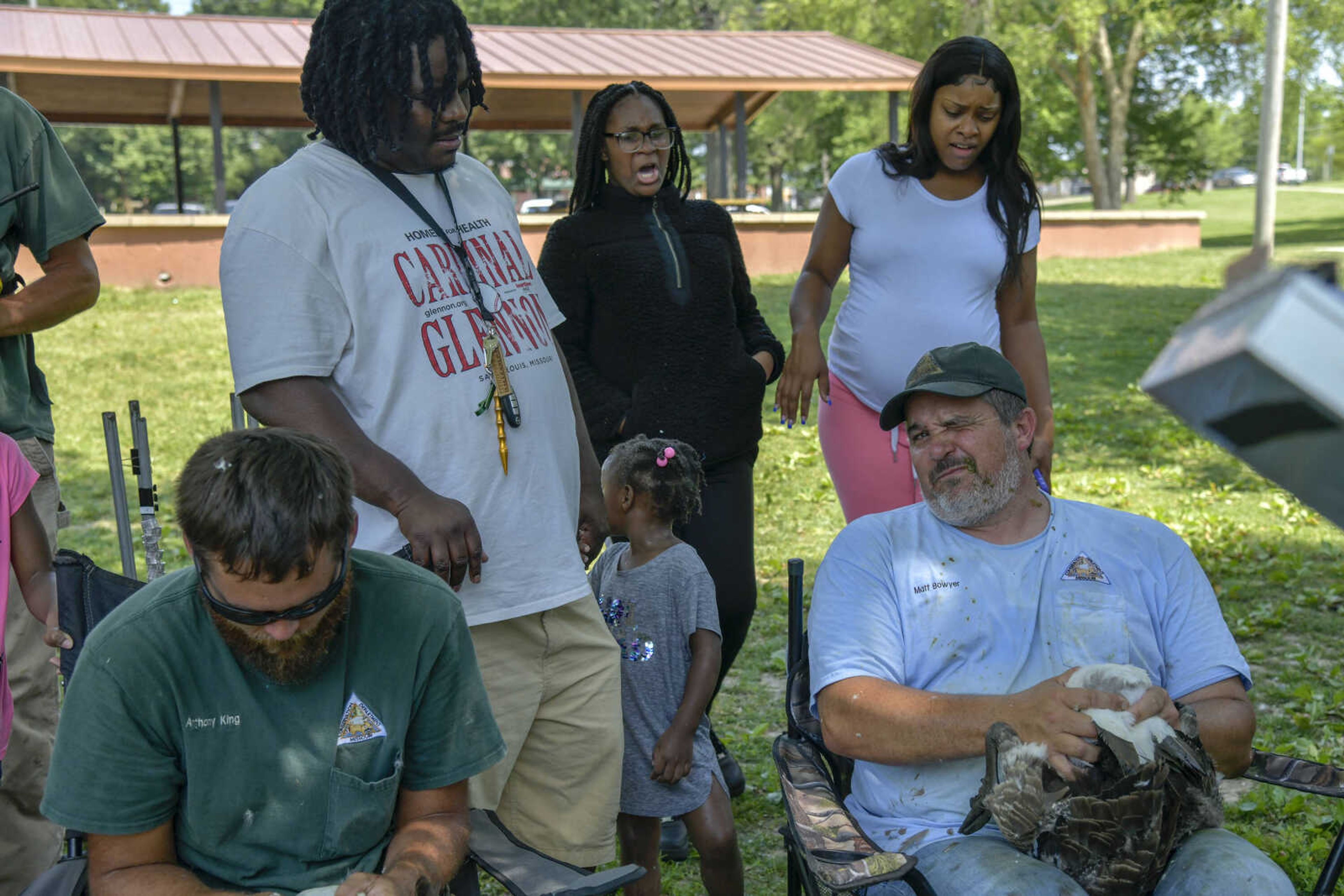 Onlookers Jeremy West, Serenity Massie and Taberah Massie, back from left, react to a goose releasing excrement on Missouri Department of Conservation employee Matt Bowyer, front right, at Capaha Park during the MDC's annual goose roundup on Thursday, June 17, 2021.