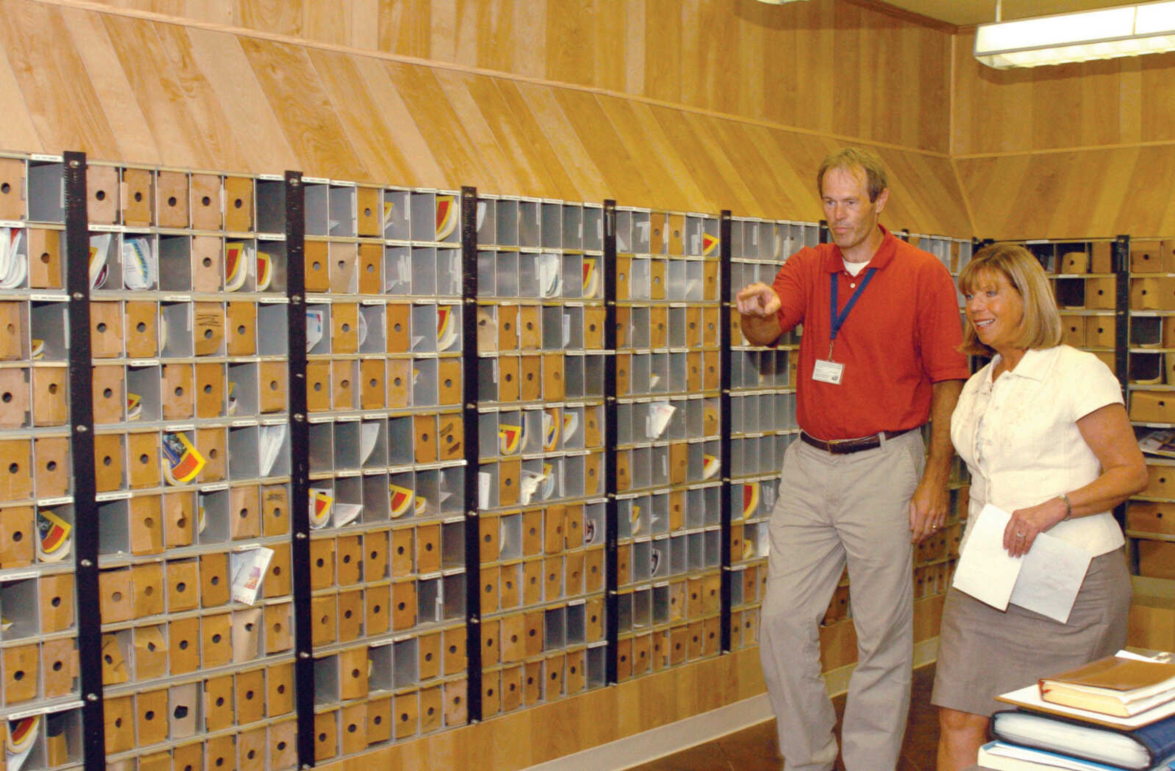 Russ Collier, Morehouse postmaster, walks Eighth District Rep. Jo Ann Emerson through the newly renovated Morehouse Post Office Thursday, Aug. 4, 2011. (Jill Bock/Standard Democrat)