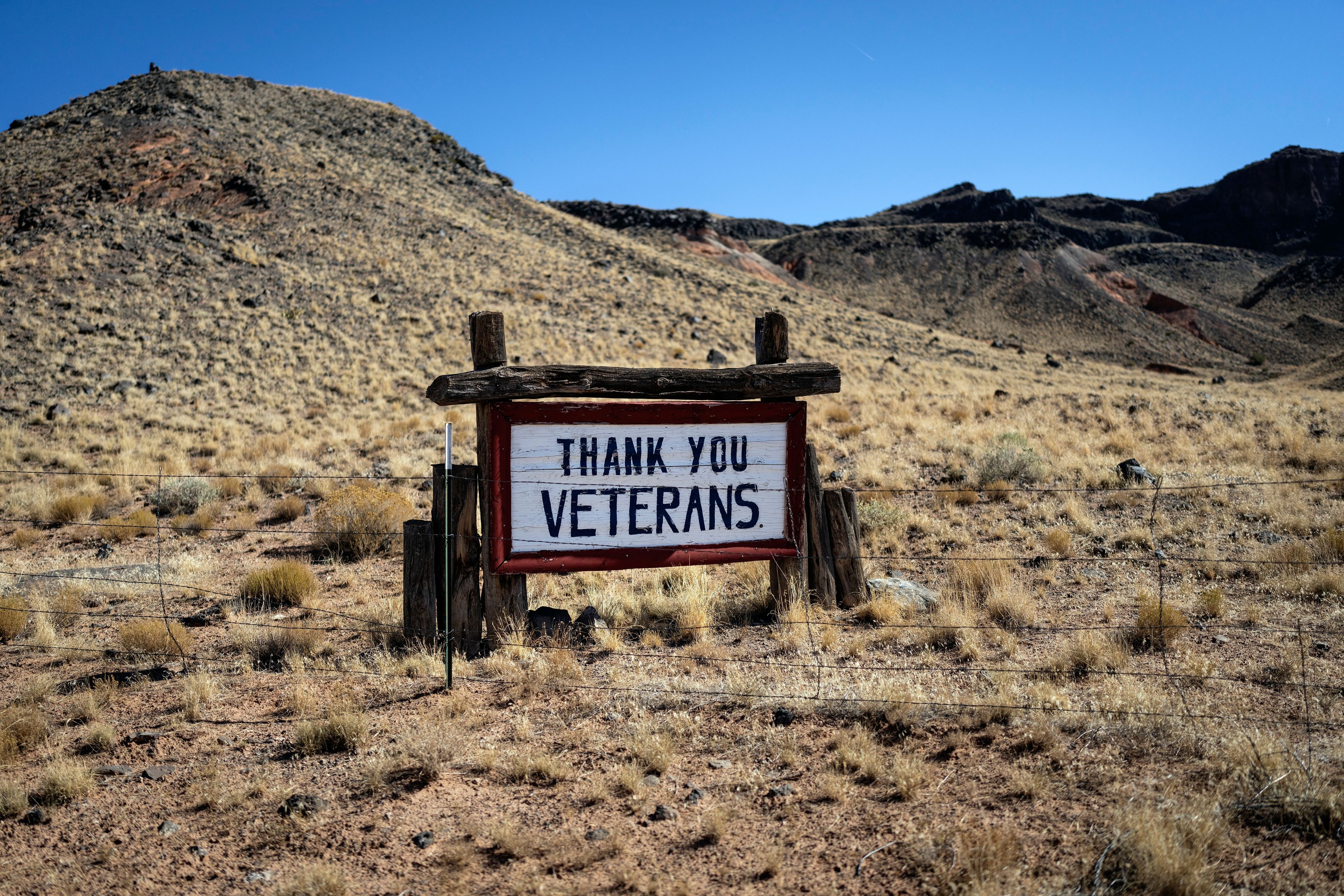 A roadside sign thanking Native Americans who served in the U.S. military, stands in a field in Indian Wells, Ariz., Saturday, Oct. 12, 2024.(AP Photo/Rodrigo Abd)