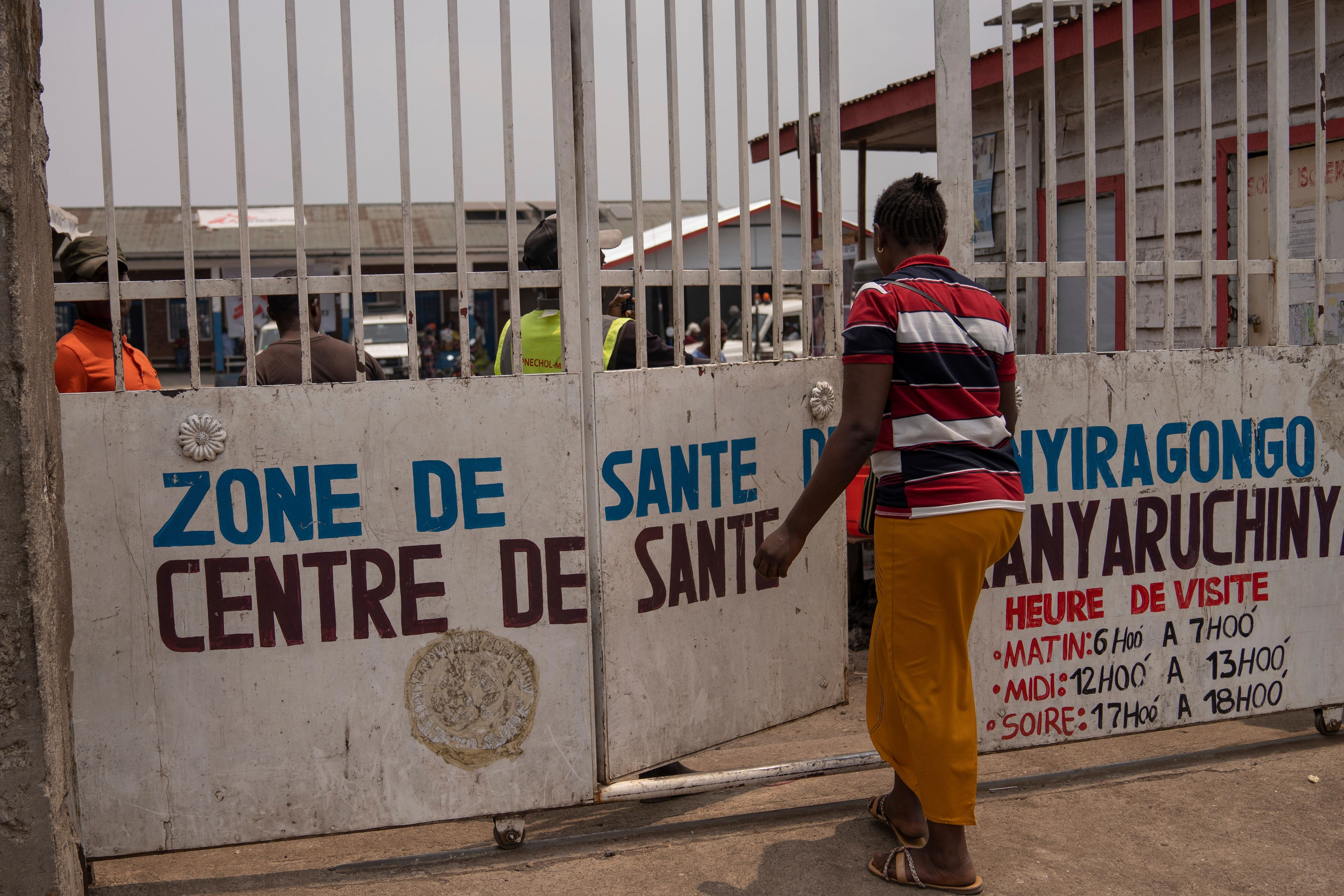 Eveline, 22 , walks to a health center seeking mental counselling in Goma, Democratic republic of the Congo, Monday, Aug. 26, 2024. (AP Photo/Moses Sawasawa)