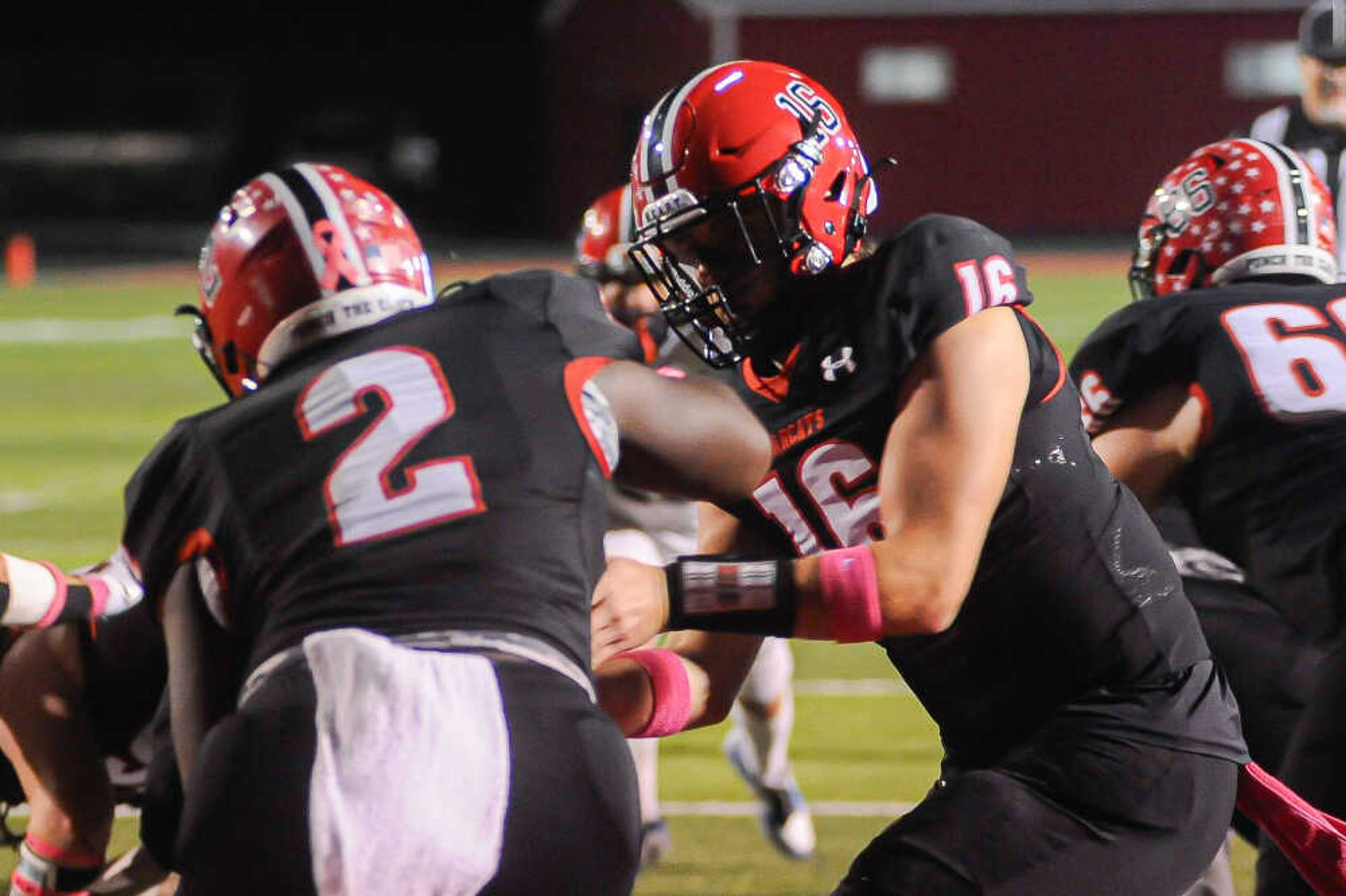 Dexter’s Jackson Howard, right, hands off to running back Jett Grams during a game between the Dexter Bearcats and the Park Hills Central Rebels on Friday, Oct. 18, at Charles Bland Stadium in Dexter.