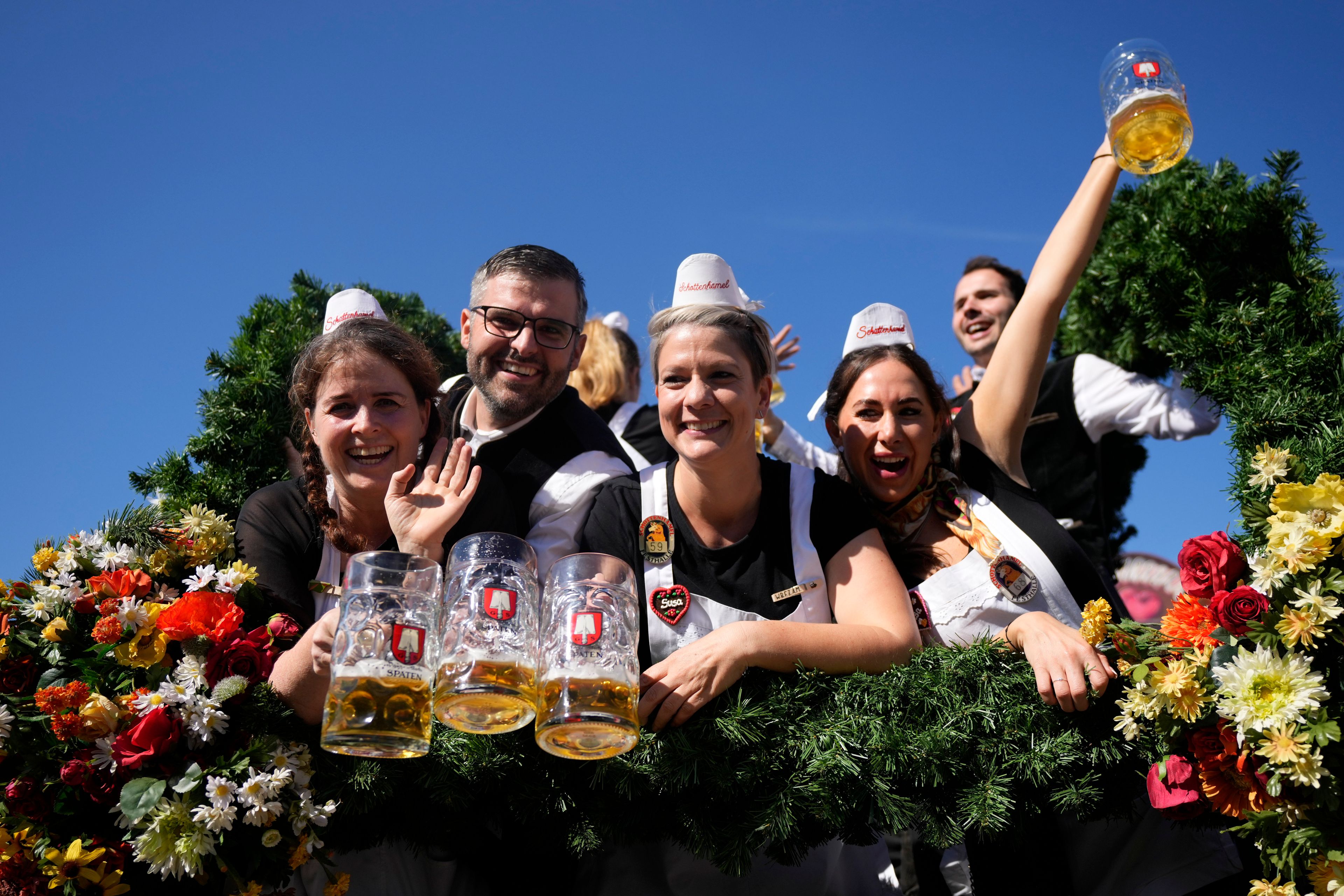 The Oktoberfest hosts arrive for the start of the 189th 'Oktoberfest' beer festival in Munich, Germany, Saturday, Sept. 21, 2024. (AP Photo/Matthias Schrader)