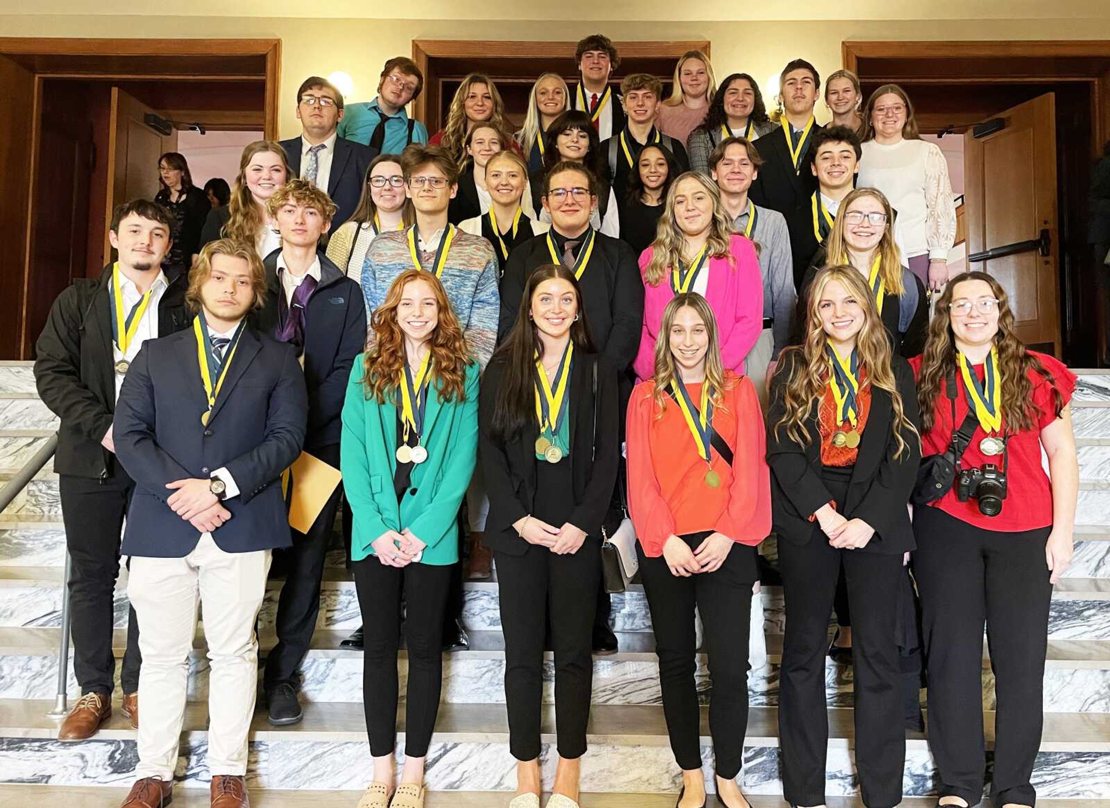 FBLA members attending districts (front row, from left) include Andrew Sitze, Presley Ridings, London Cureton, Carrie Long, Kayla McLard and Tenielle Melendy; (second row, from left) Weston Roark, Hayden Vangennip, Jase Massa, Ben Gabriel, Layla Wiseman and Chloe Green; (third row, from left) Mattie Simmons, Chloe Simmons, Abbey Jordan, Aaron Stewart and Jespn Evans; (fourth row, from left) Caden Milam, Cadence Merrell, Katelynn Hahs, Kiarra Davis, Drew Tarble and Ellsie Wilkinson; (fifth row, from left) Dalton Tharp, Kallie Davis, Zaylee Whitener-Cowell, Zach Lehmann, Emma Milam and Sara Koenig; and (back row, from left) Dillard Englehart and Jayden Burney.