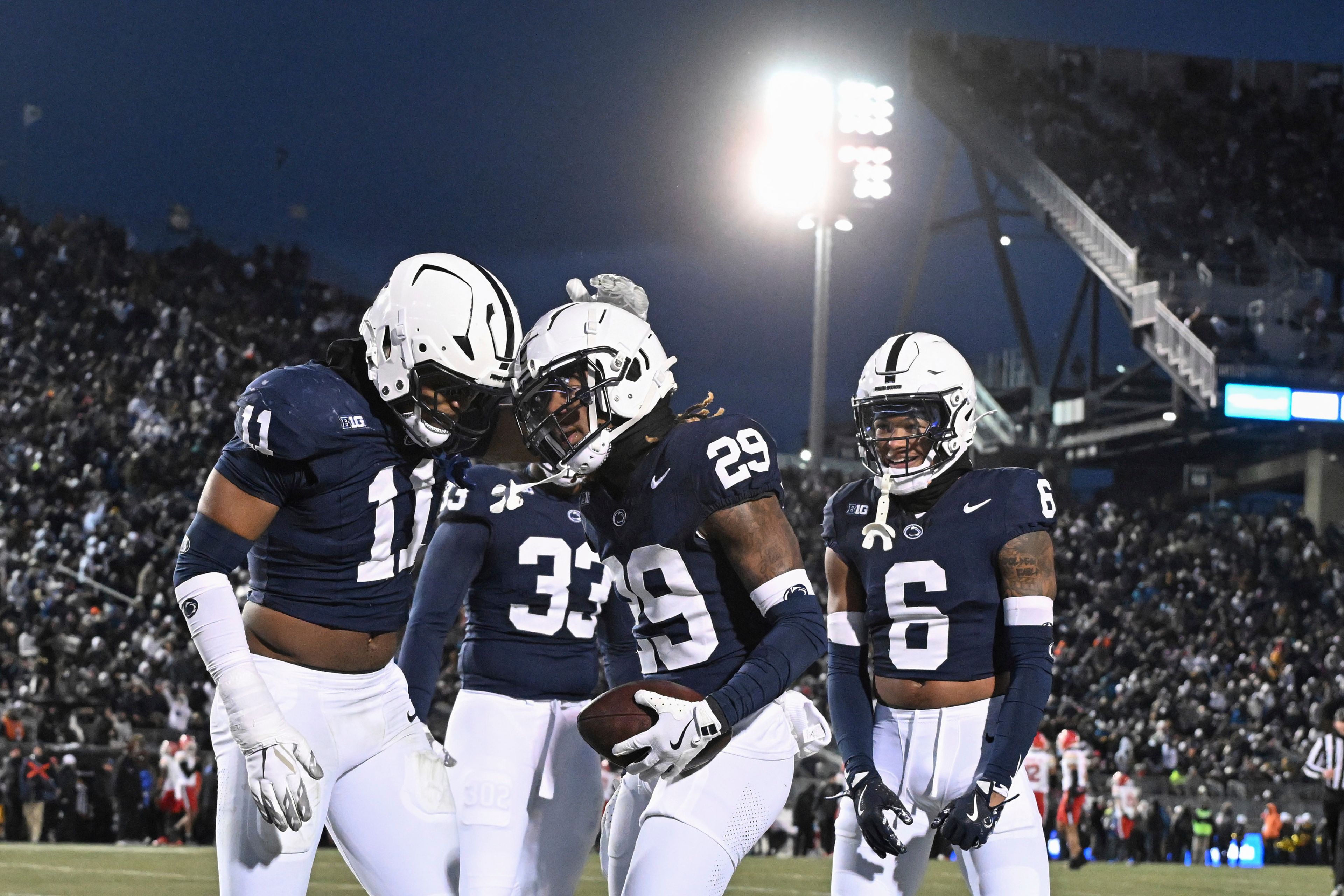 Penn State cornerback Audavion Collins (29) celebrates after an interception with Abdul Carter (11) during the second quarter of an NCAA college football game against Maryland, Saturday, Nov. 30, 2024, in State College, Pa. (AP Photo/Barry Reeger)