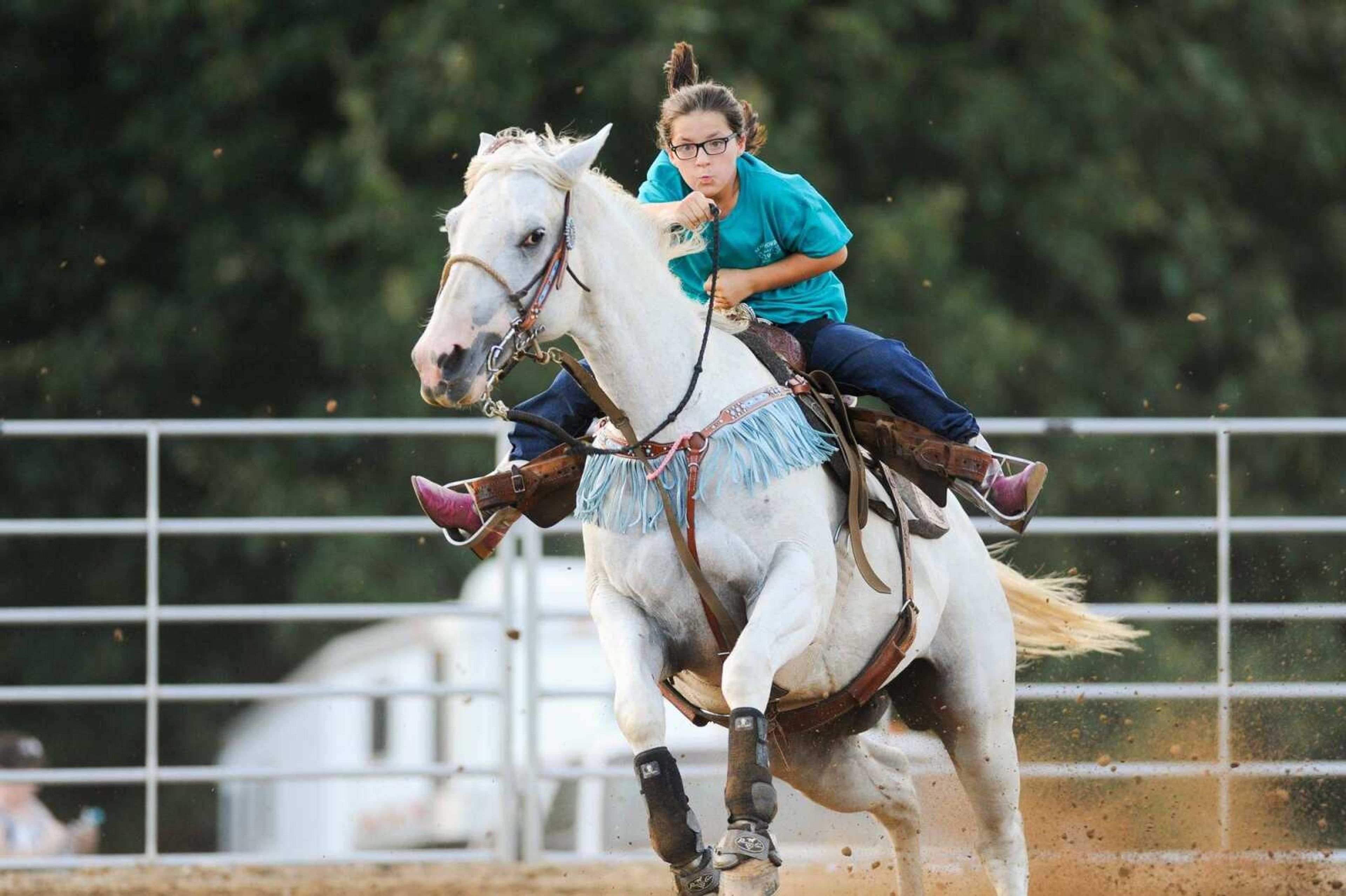 Riley Jo Gossett guides Gracie during a barrel race Saturday evening at the Rockin' JK Arena in Marble Hill, Missouri. More photos of the competition are in a gallery at semissourian.com. (glandberg@ semissourian.com)