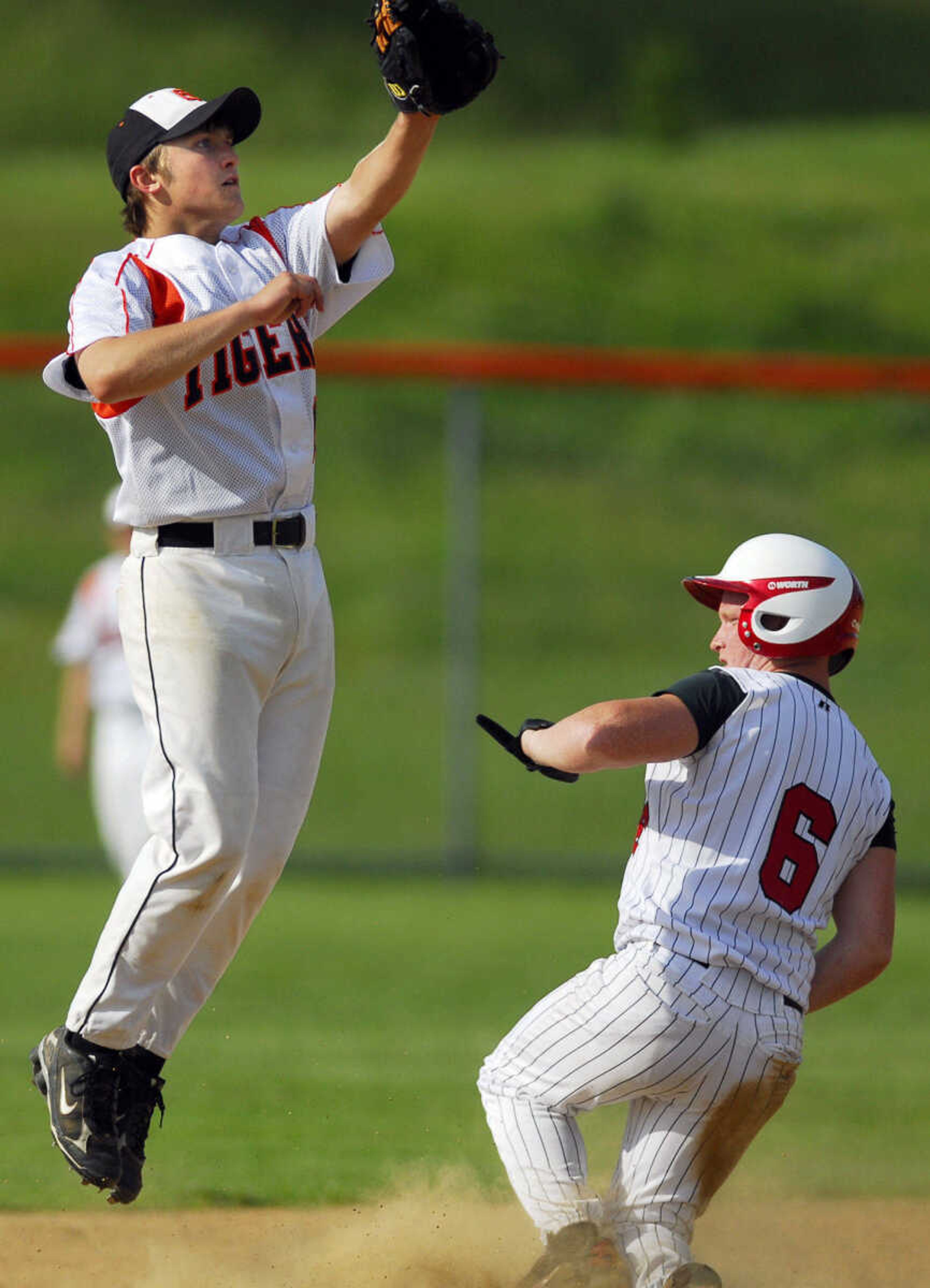 Chaffee's Hunter Thomason steals second as Blake Smith jumps for the throw Monday, May 11, 2009, at Central High in Cape Girardeau.