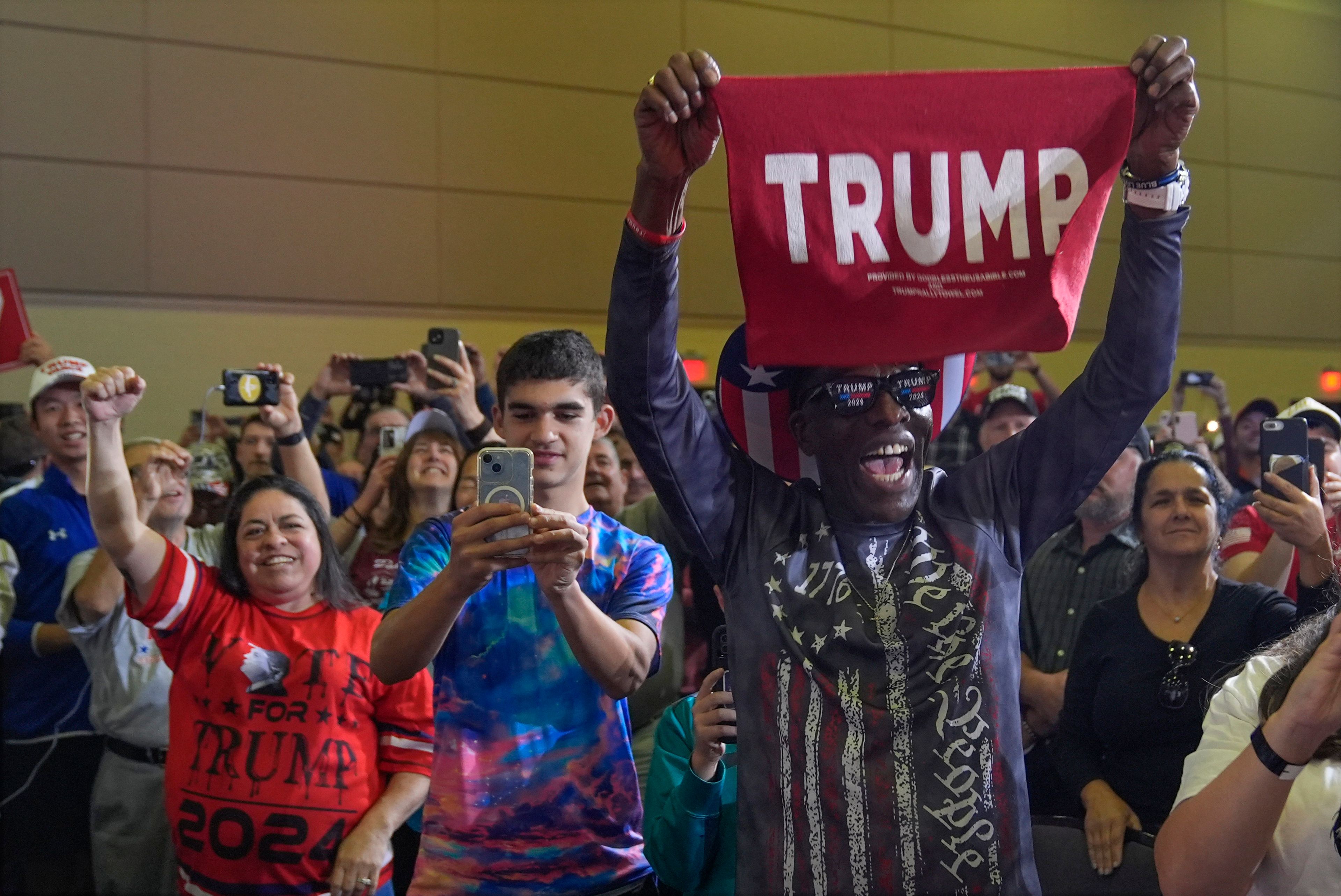 Supporters listen as Republican presidential nominee former President Donald Trump speaks at a town hall at Lancaster County Convention Center, Sunday, Oct. 20, 2024, in Lancaster, Pa. (AP Photo/Evan Vucci)