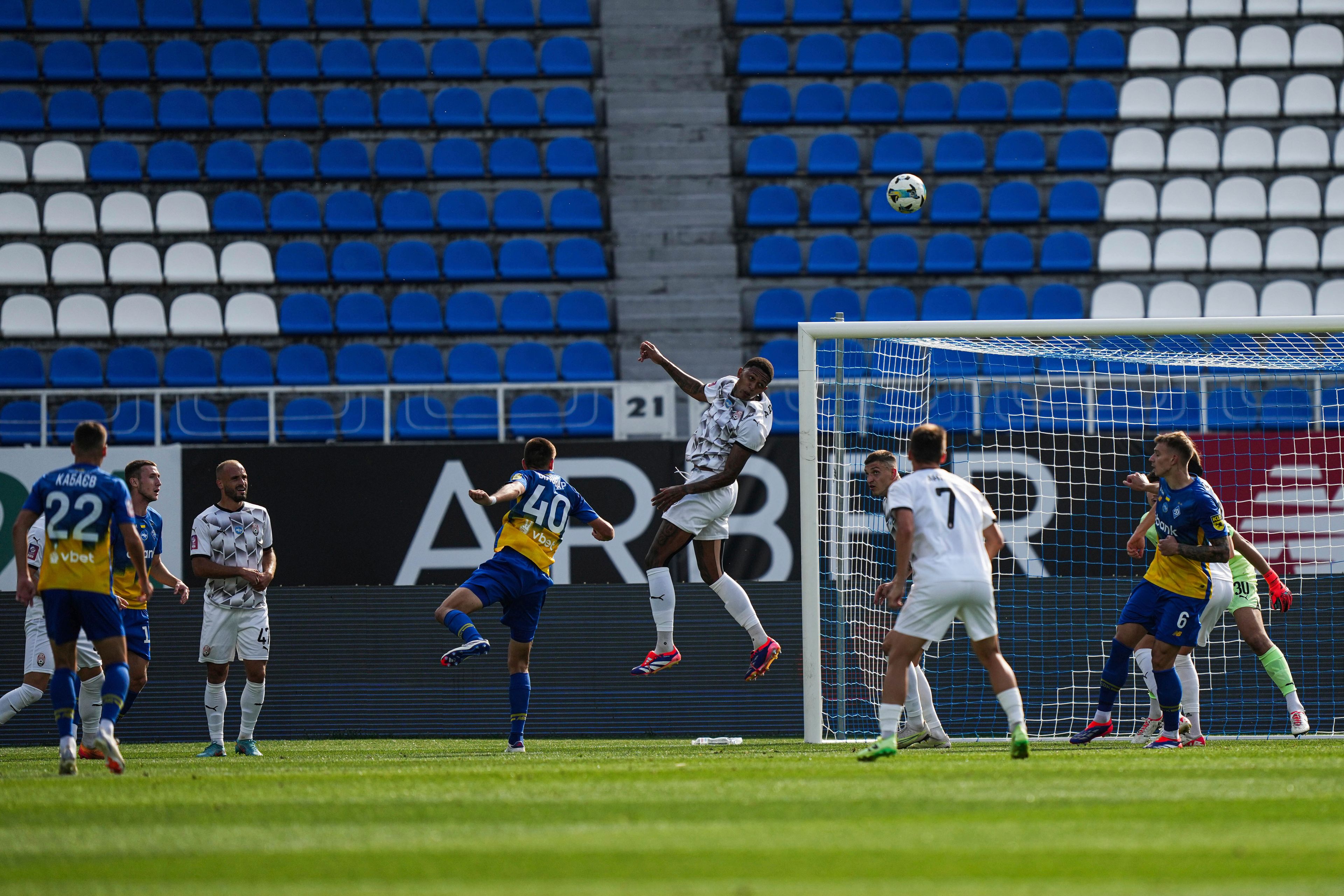 Christian Bilovar of Dynamo Kyiv watches as Benito of Zorya Luhansk, center, clears the ball during a soccer match of Ukrainian Premier League in Kyiv, Ukraine, Saturday Sept. 14, 2024. (AP Photo/Evgeniy Maloletka)