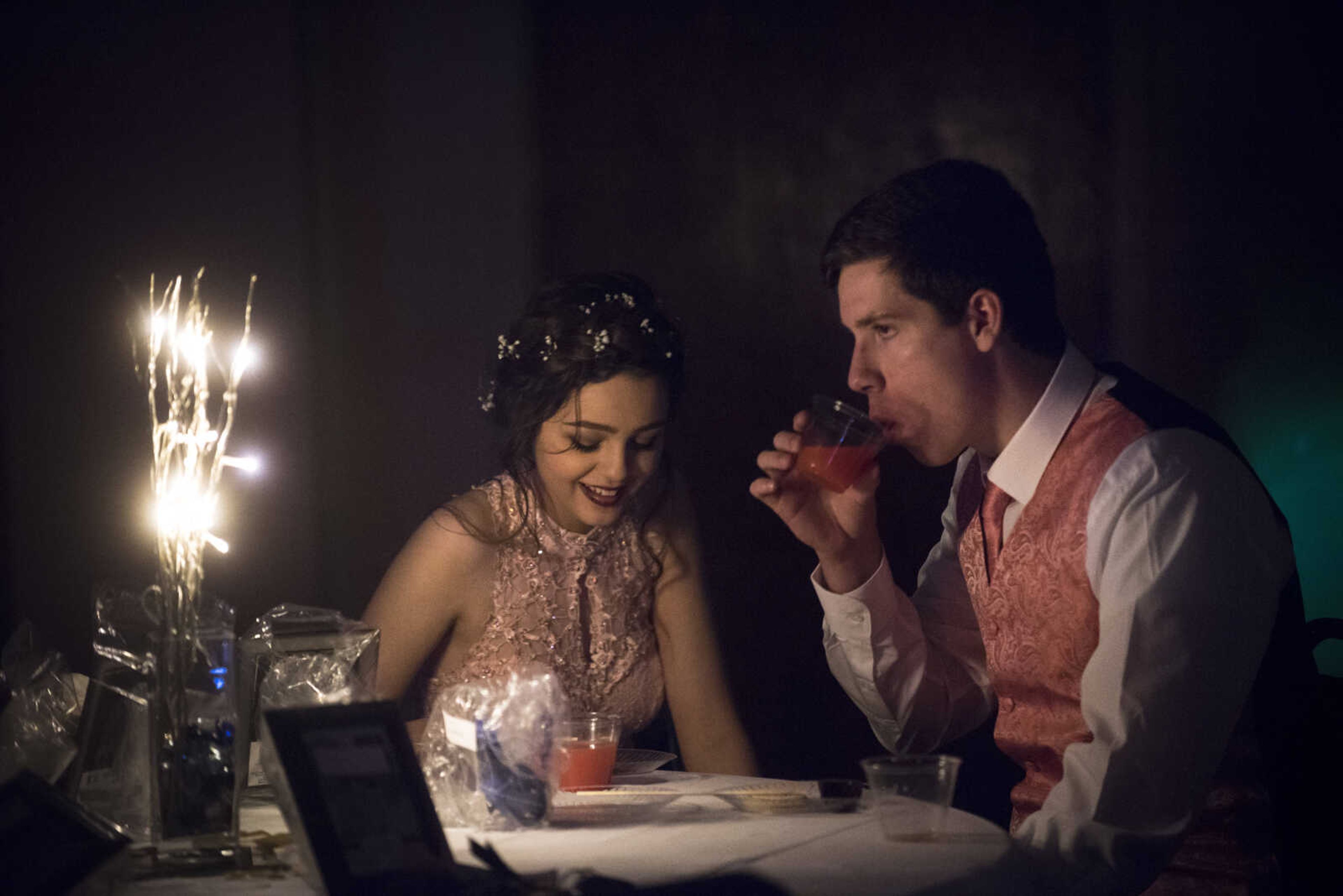 Students sit down for a drink during the Saxony Lutheran prom Saturday, April 22, 2017 at the Elk's Lodge in Cape Girardeau.