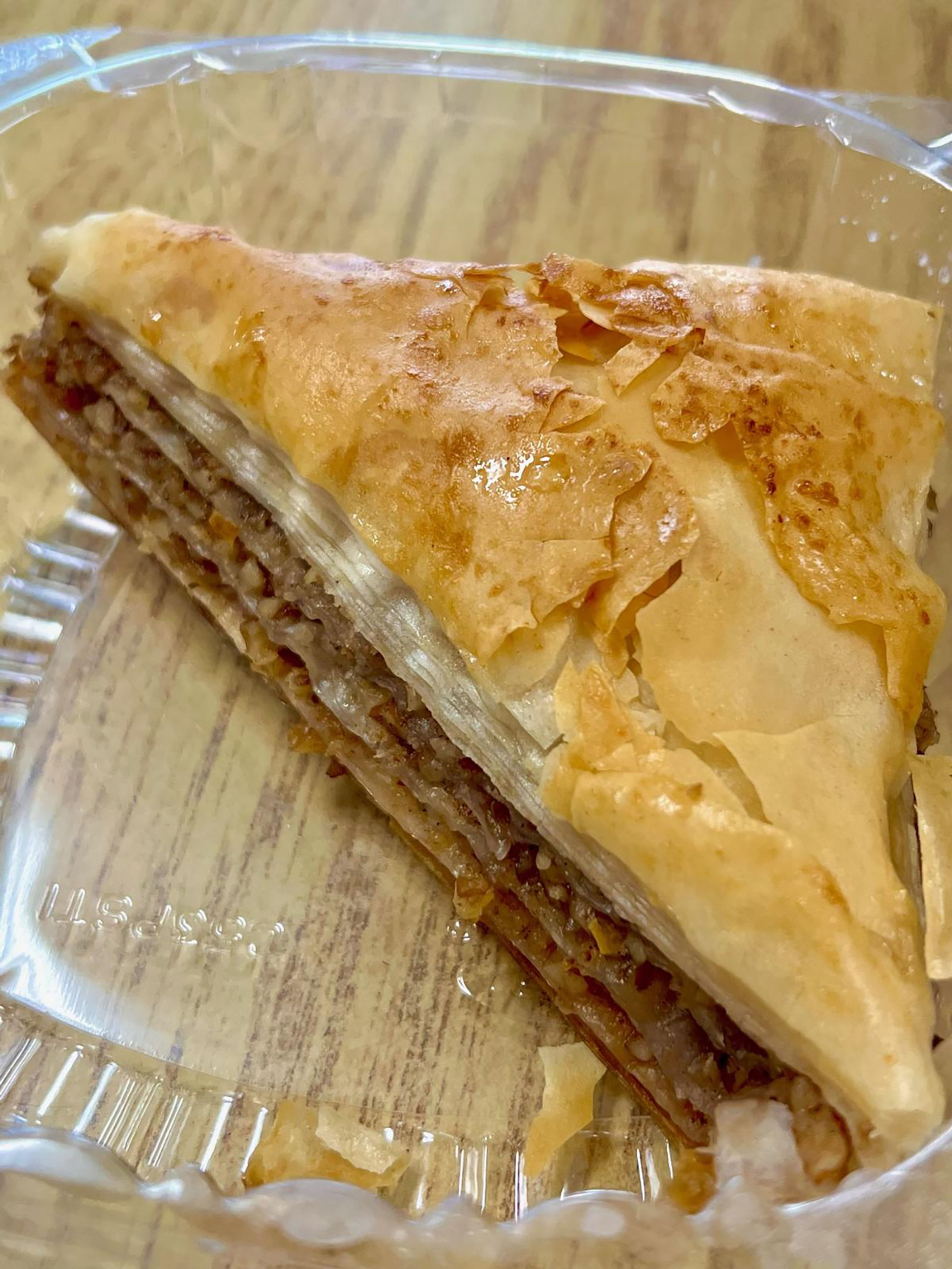 The bakalava a popular middle eastern pastry made with layers of phyllo dough filled with chopped nuts and soaked in syrup.