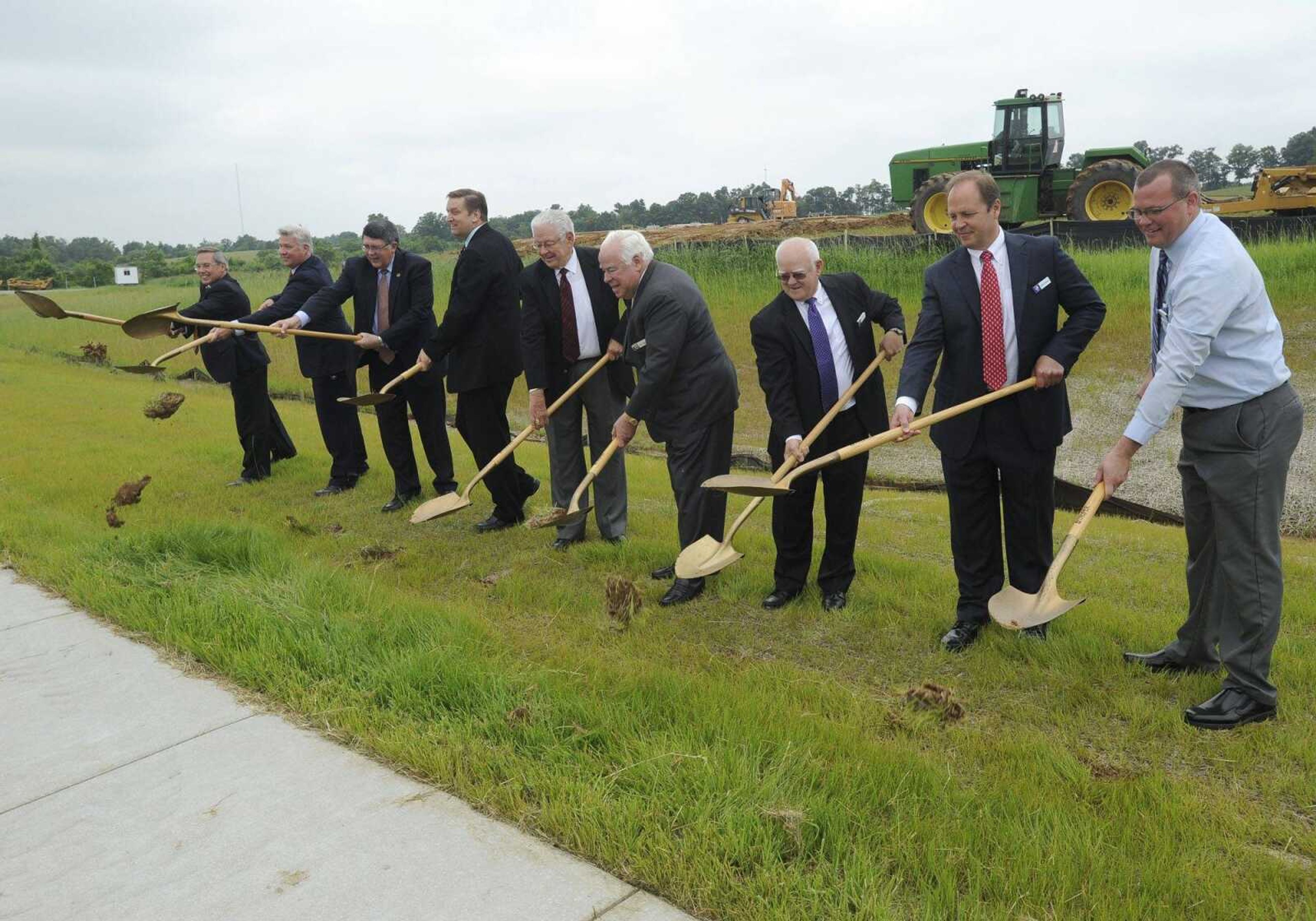 A groundbreaking ceremony for Pepsi Depot included, from left, Danny Essner, Missouri Department of Economic Development business development manager Jason Archer, Dr. Ken Dobbins, Cape Girardeau city manager Scott Meyer, Cape Girardeau mayor Harry Rediger, Pepsi MidAmerica CEO Harry L. Crisp II, Pepsi MidAmerica executive vice president John Rains, senior vice president of sales and marketing Keith Dickens, and division general manager Justin Vetter, on Wednesday, June 3, 2015 at the Greater Cape Girardeau Business Park. (Fred Lynch)