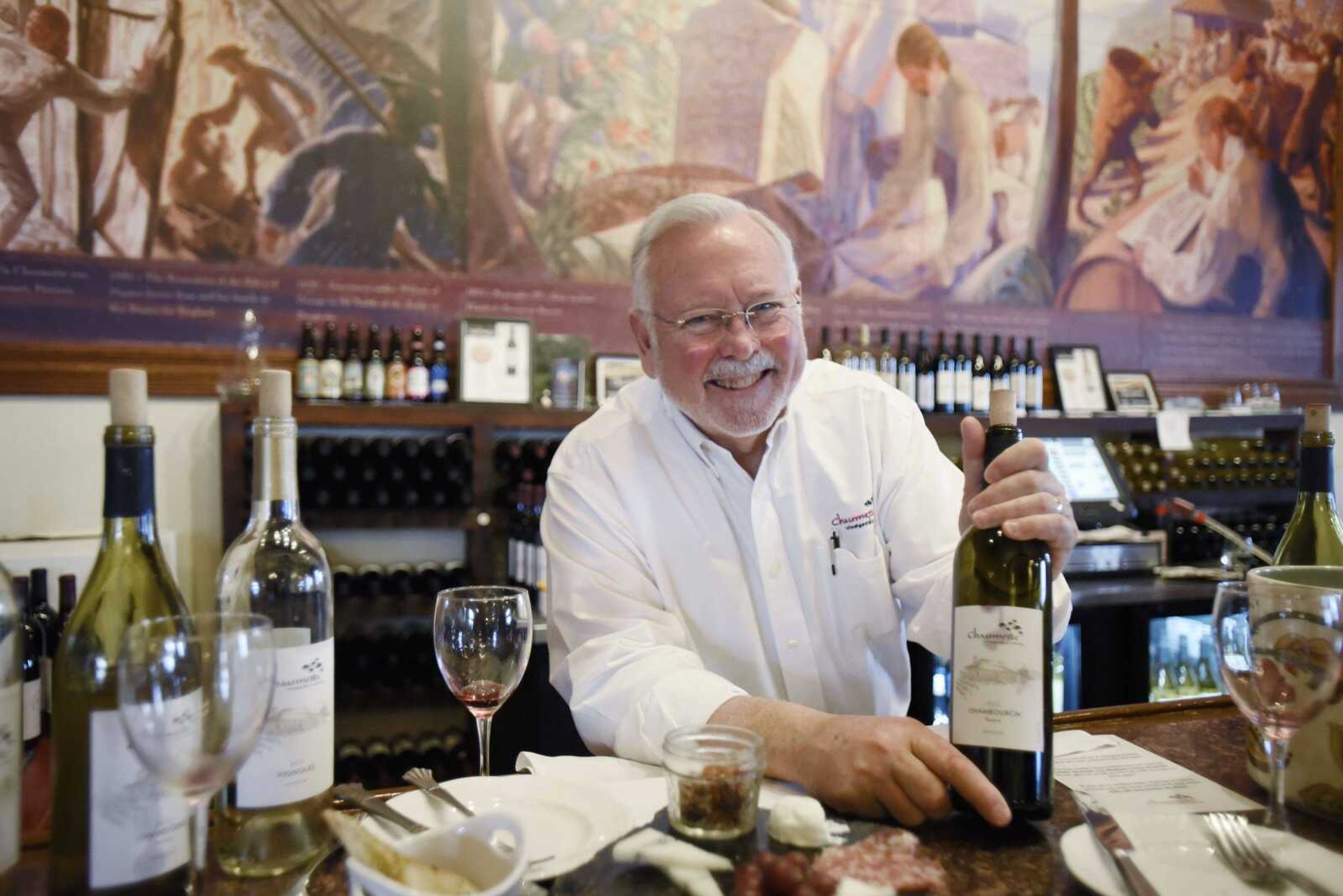 LAURA SIMON ~ lsimon@semissourian.com    Hank Johnson, owns of Chaumette Vineyards & Winery, holds a sample of the 2015 Chambourcin Reserve in the tasting room on Friday, March 17, 2017, in Ste. Genevieve, Missouri.