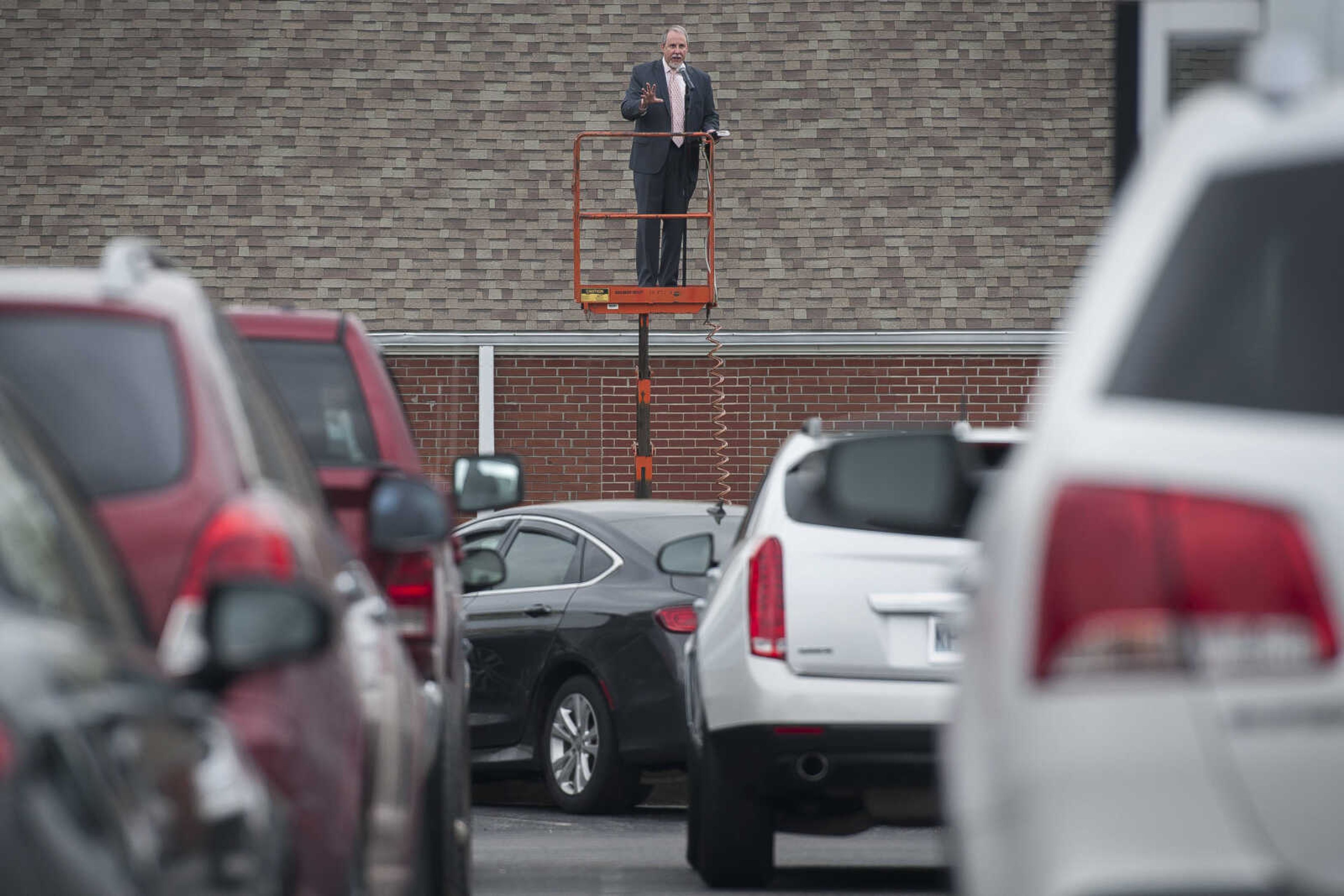 First Baptist Jackson senior pastor Troy Richards delivers a sermon to more than 50 vehicles in attendance at the church's drive-in service held Easter Sunday, April 12, 2020, in Jackson.