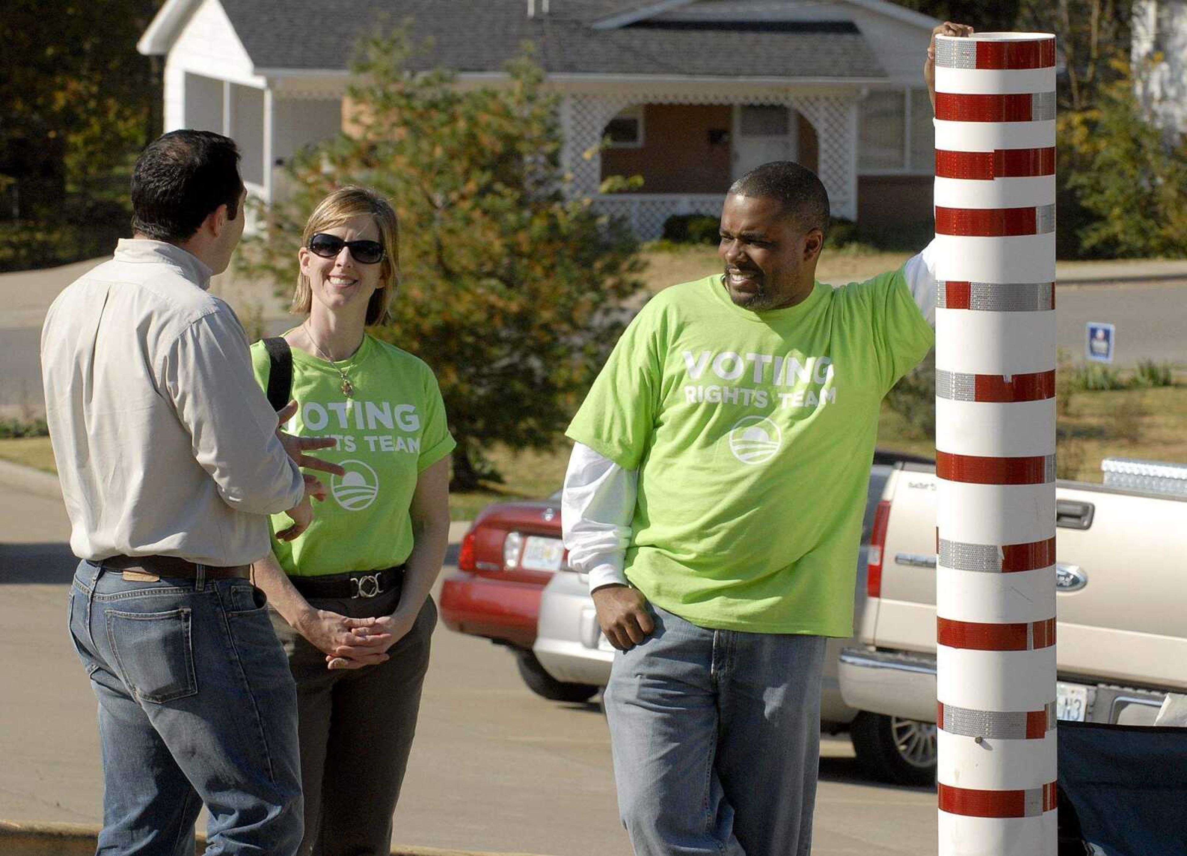 ELIZABETH DODD ~ edodd@semissourian.com
Representatives from the Obama campaign, Gordon Glaus, of Cape Girardeau, left, Sharon Love, of Memphis and Carlos Bibbs, of Memphis, stand outside the American Legion in Jackson to help anyone with voter related questions.