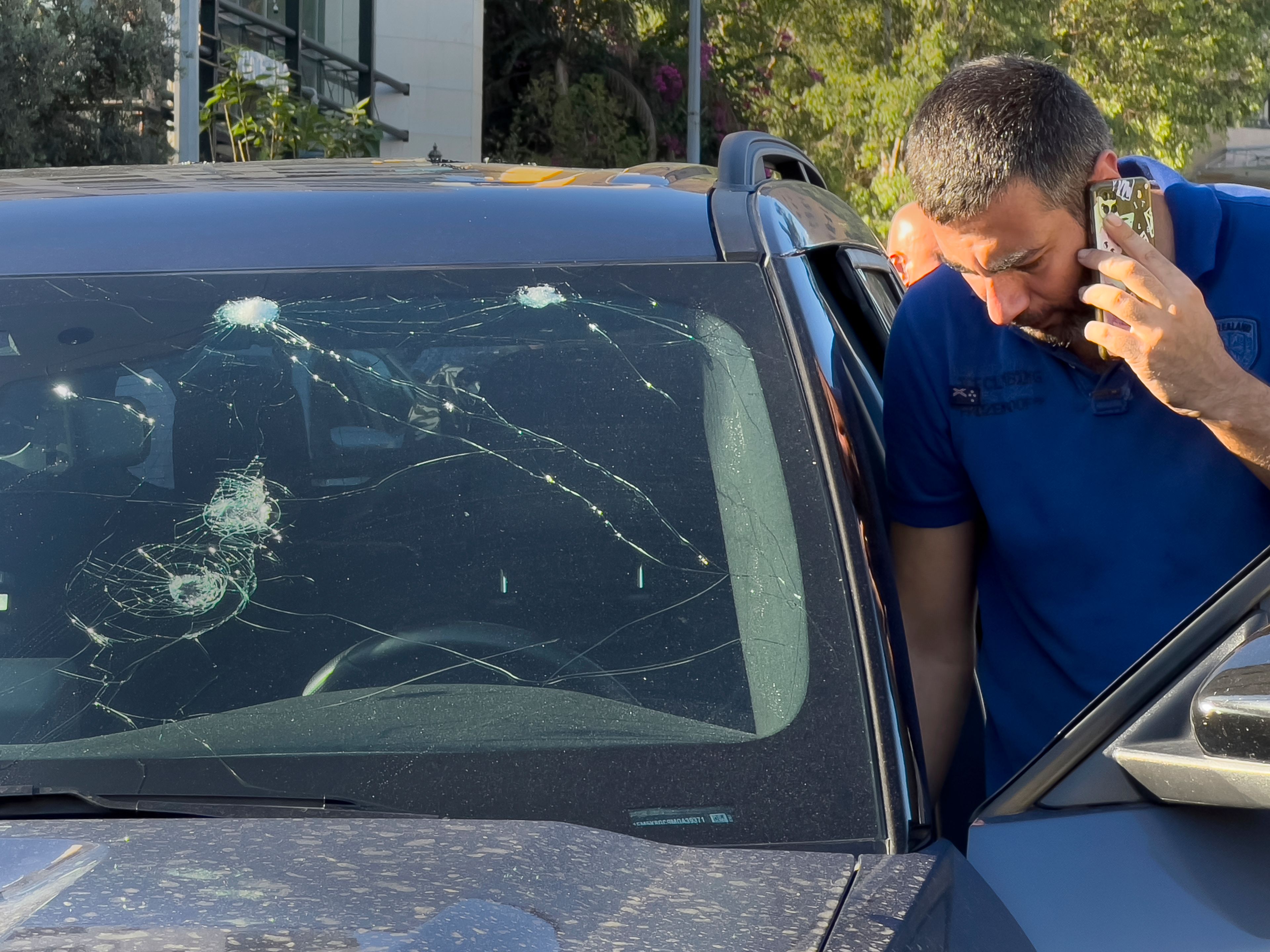 A police officer inspects a car in which a hand-held pager exploded, in Beirut, Lebanon, Tuesday, Sept. 17, 2024. (AP Photo/Hussein Malla)