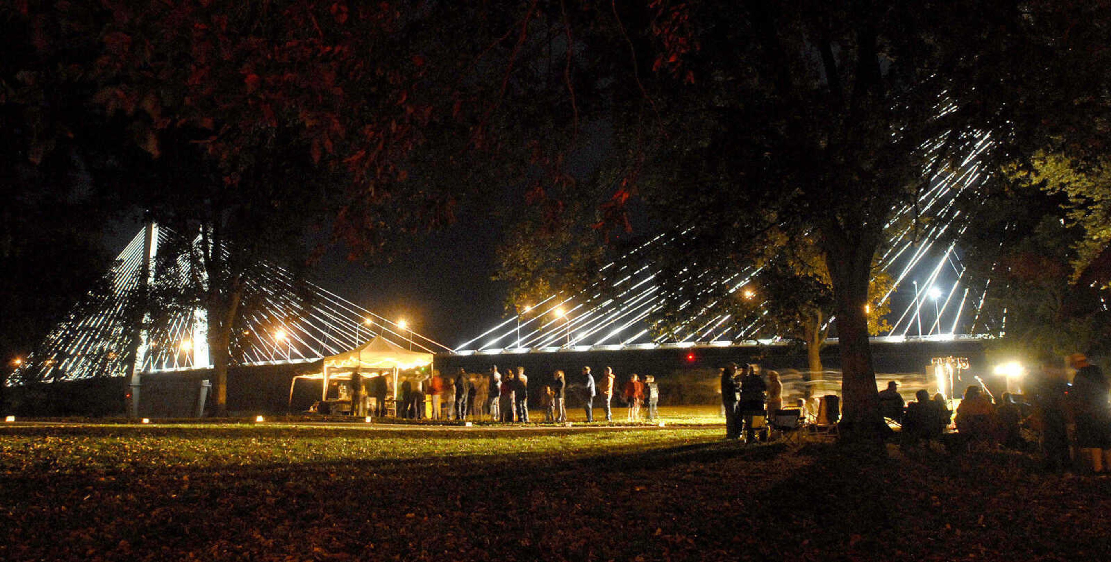 LAURA SIMON ~ lsimon@semissourian.com
The crowd listens to bone chilling tales from story tellers Regina Carpenter and Gayle Ross Friday, October 14, 2011 during an evening of Ghost Storytelling at the east lawn of the River Campus of Southeast Missouri State University in Cape Girardeau.