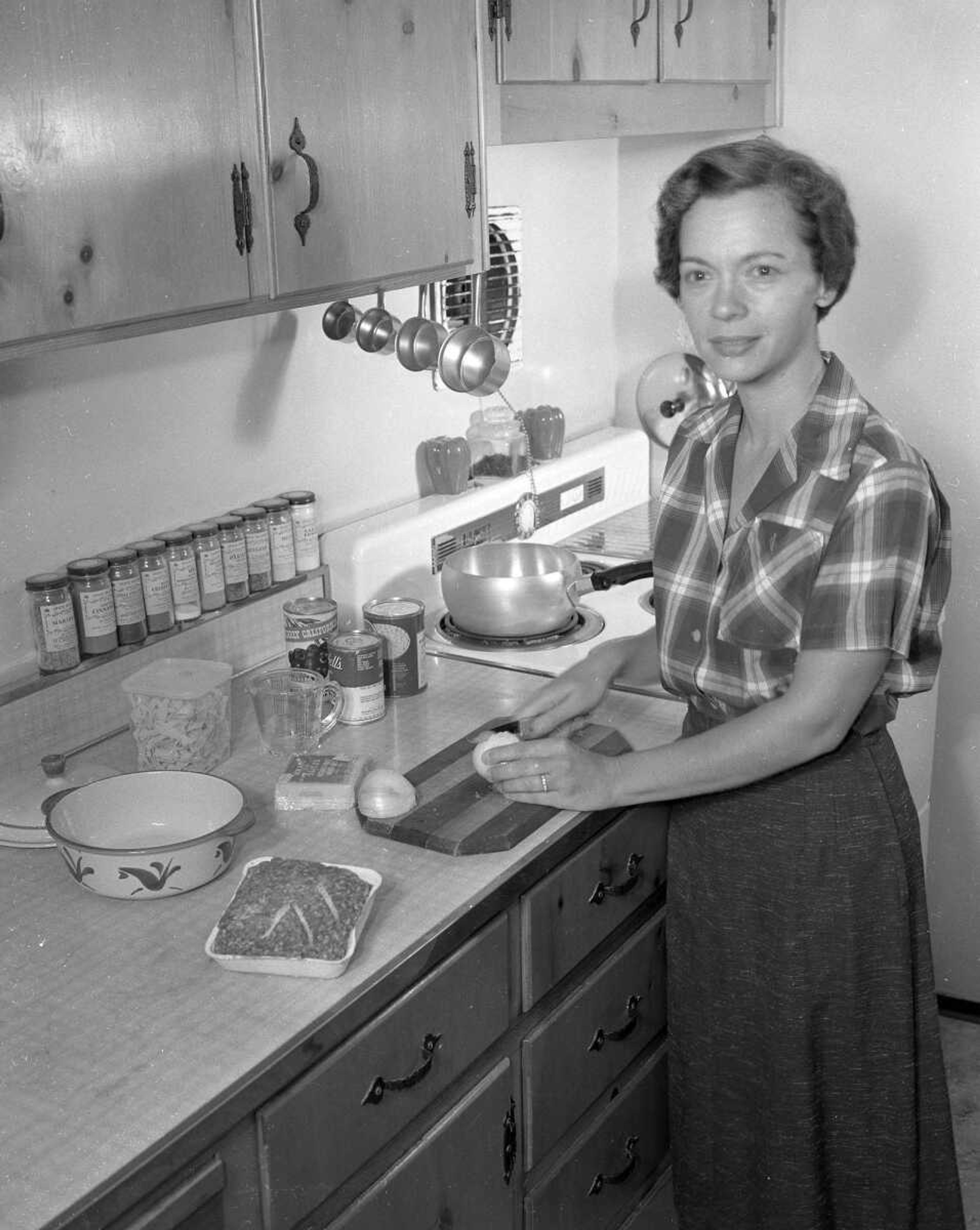 An unidentified cook prepares to dice an onion. If you can provide information about this image, contact librarian Sharon Sanders at ssanders@semissourian.com.