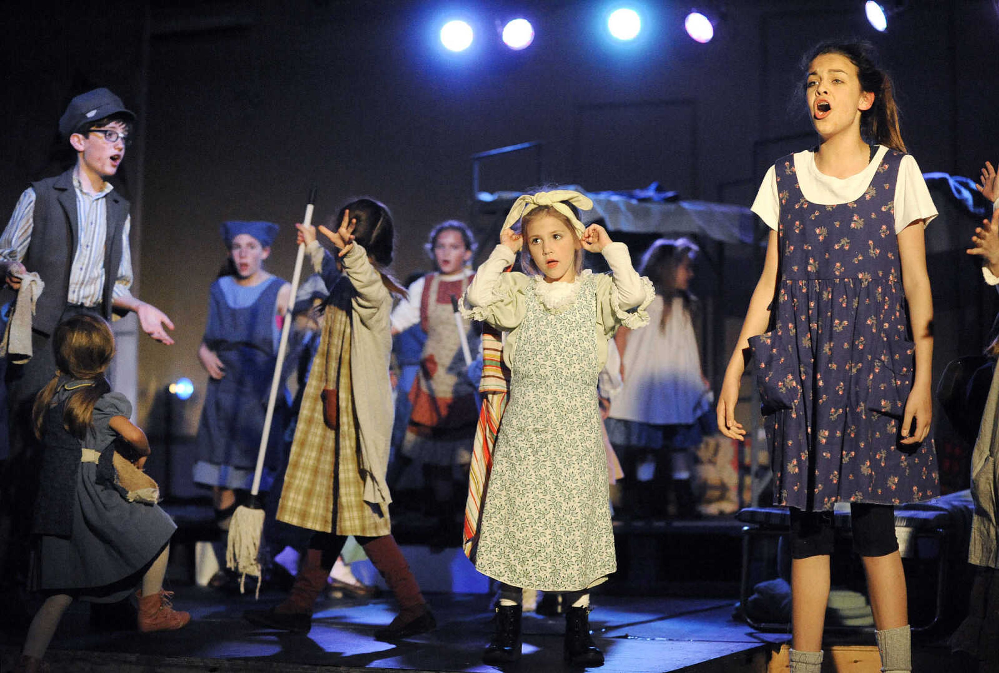 LAURA SIMON ~ lsimon@semissourian.com

Cast members rehearse for "Annie Jr." Wednesday night, May 4, 2016, at The Venue in Cape Girardeau. The condensed version of "Annie" is being produced by On Cue Performing Arts Studio, and the not-for-profit local theater group Acting Out!.