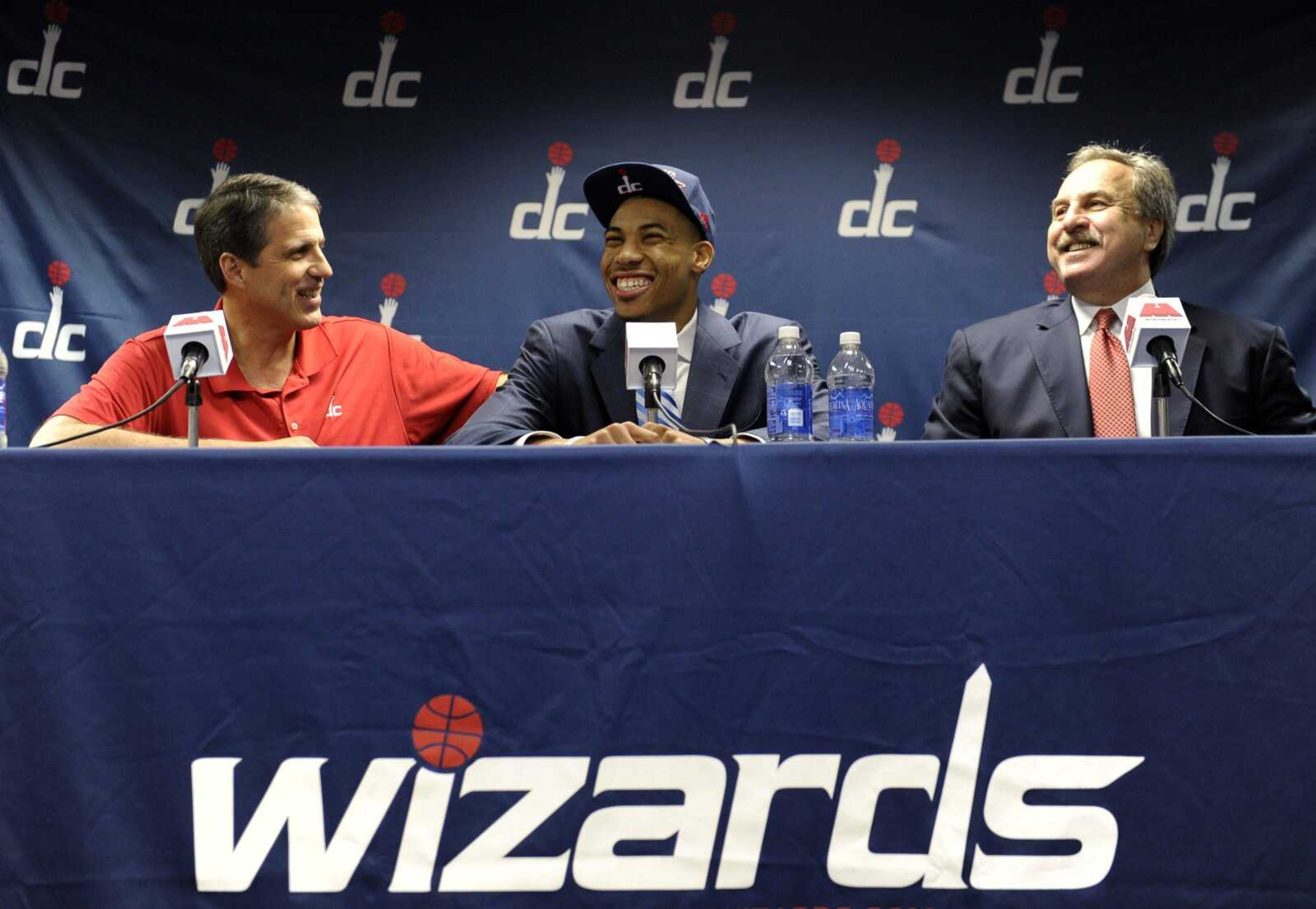 Wizards draft pick Otto Porter, the third player taken overall in the 2013 NBA draft, shares a laugh with coach Randy Wittman, left, and team president Ernie Grunfeld, right, during a news conference Friday at the Verizon Center in Washington. (Susan Walsh ~ Associated Press)