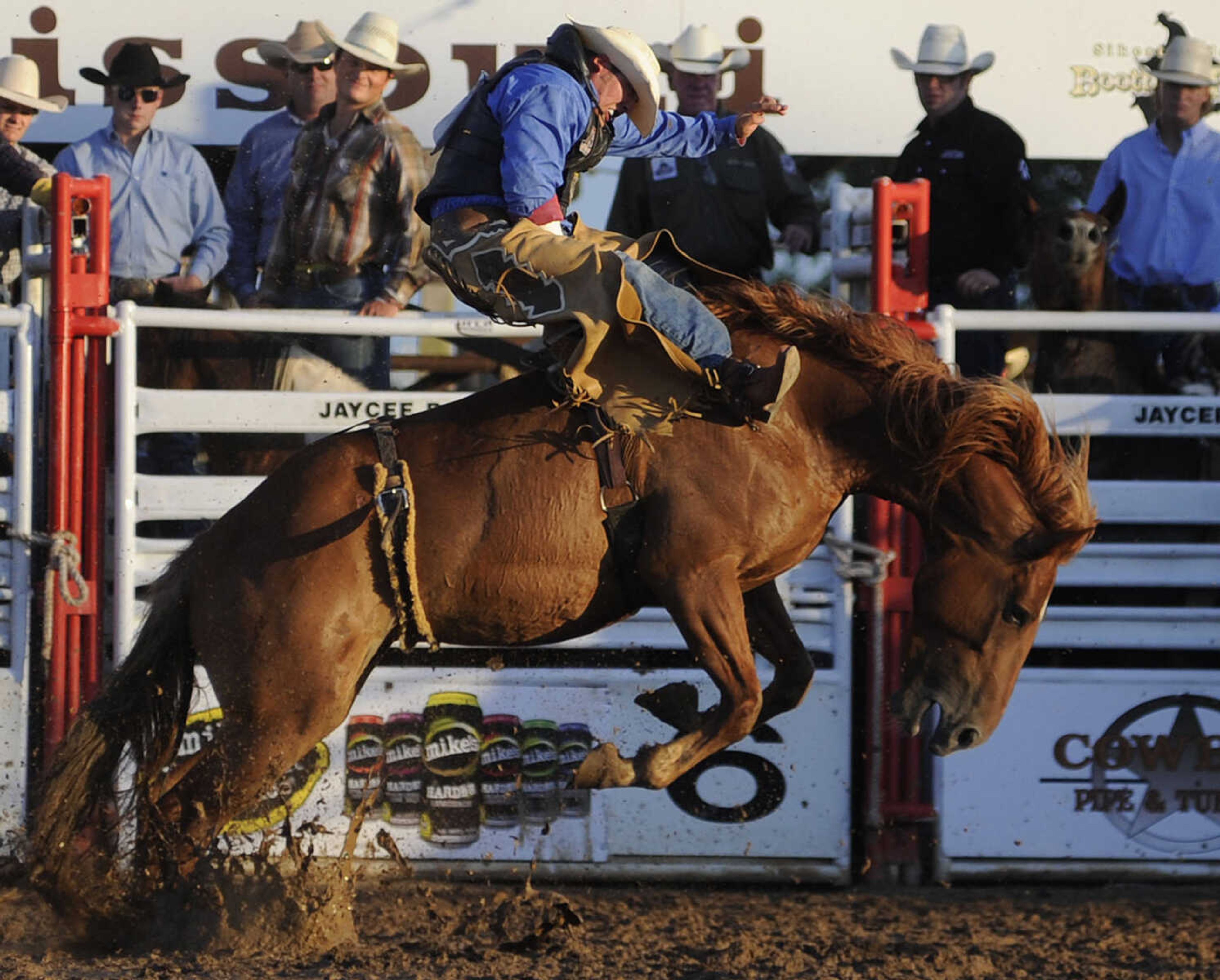 Andy Carter of Ellisnore, Mo., rides Dollar Whiskey in the bareback riding competition at the Sikeston Jaycee Bootheel Rodeo Wednesday, August 7, in Sikeston, Mo. Carter received a score of 71 for his ride.