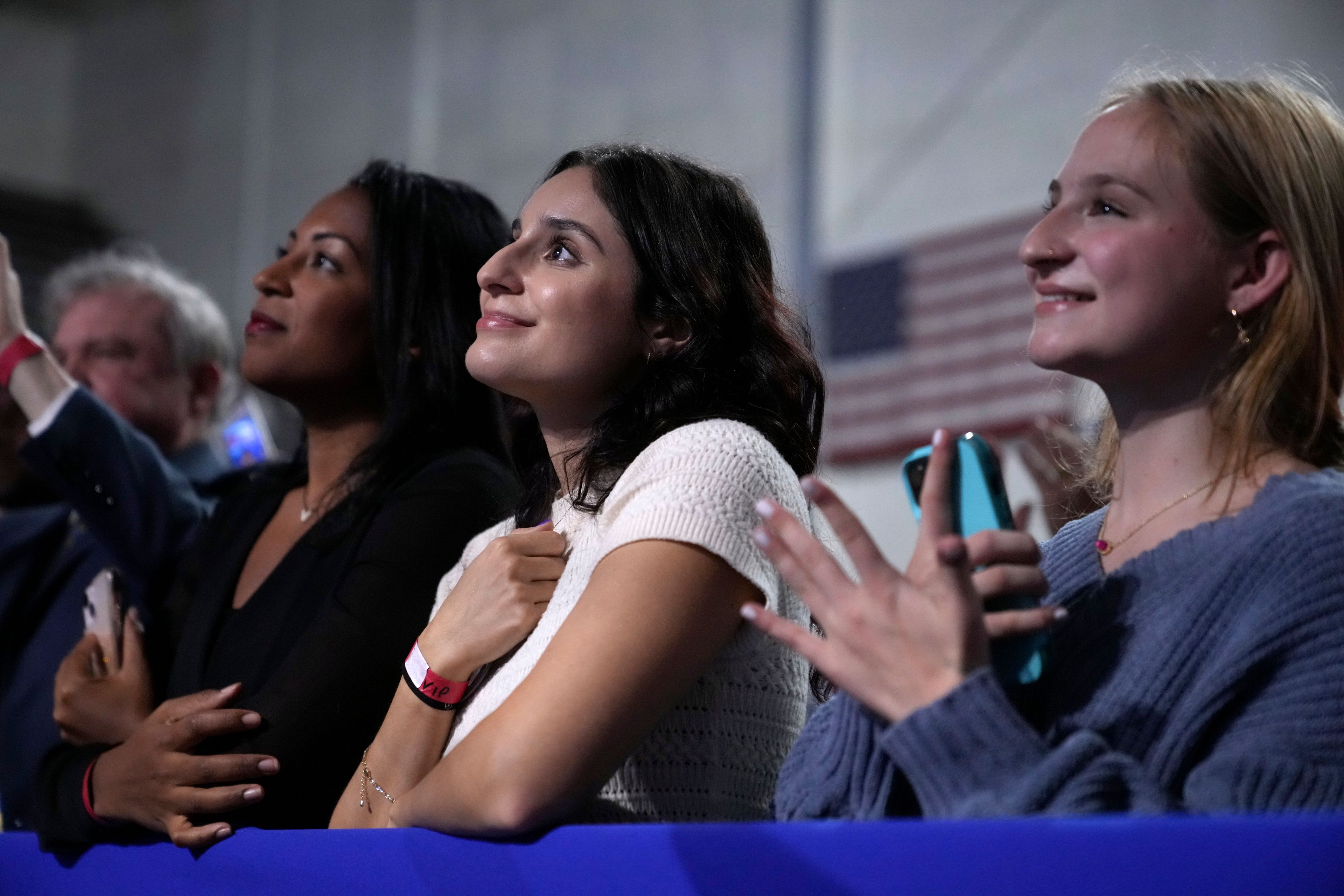 Supporters react as Democratic presidential nominee Vice President Kamala Harris speaks during a campaign rally in Memorial Hall at Muhlenberg College in Allentown, Pa., Monday, Nov. 4, 2024. (AP Photo/Jacquelyn Martin)