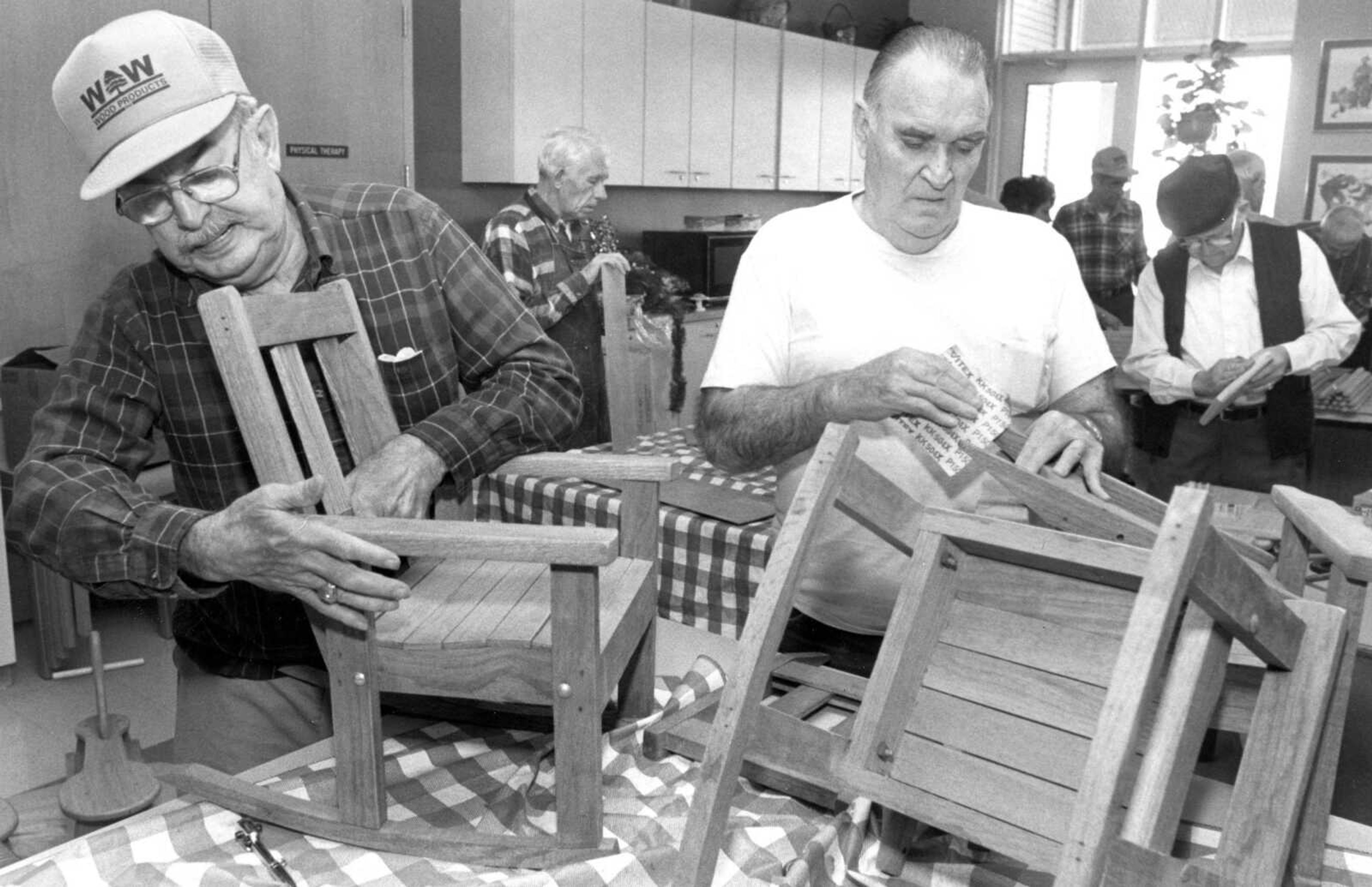 Published Dec. 9, 1992.
Charles Lincoln, left, and Pete Jarrell work on constructing oak rocking chairs, which a few lucky children will receive from the Toybox program when Jaycee Santas make their rounds on Dec. 17. The two men and some other residents of the Missouri Veterans Home are using their woodworking skills to make the chairs, rocking horses and doll cradles and high chairs. (Fred Lynch ~ Southeast Missourian archive)