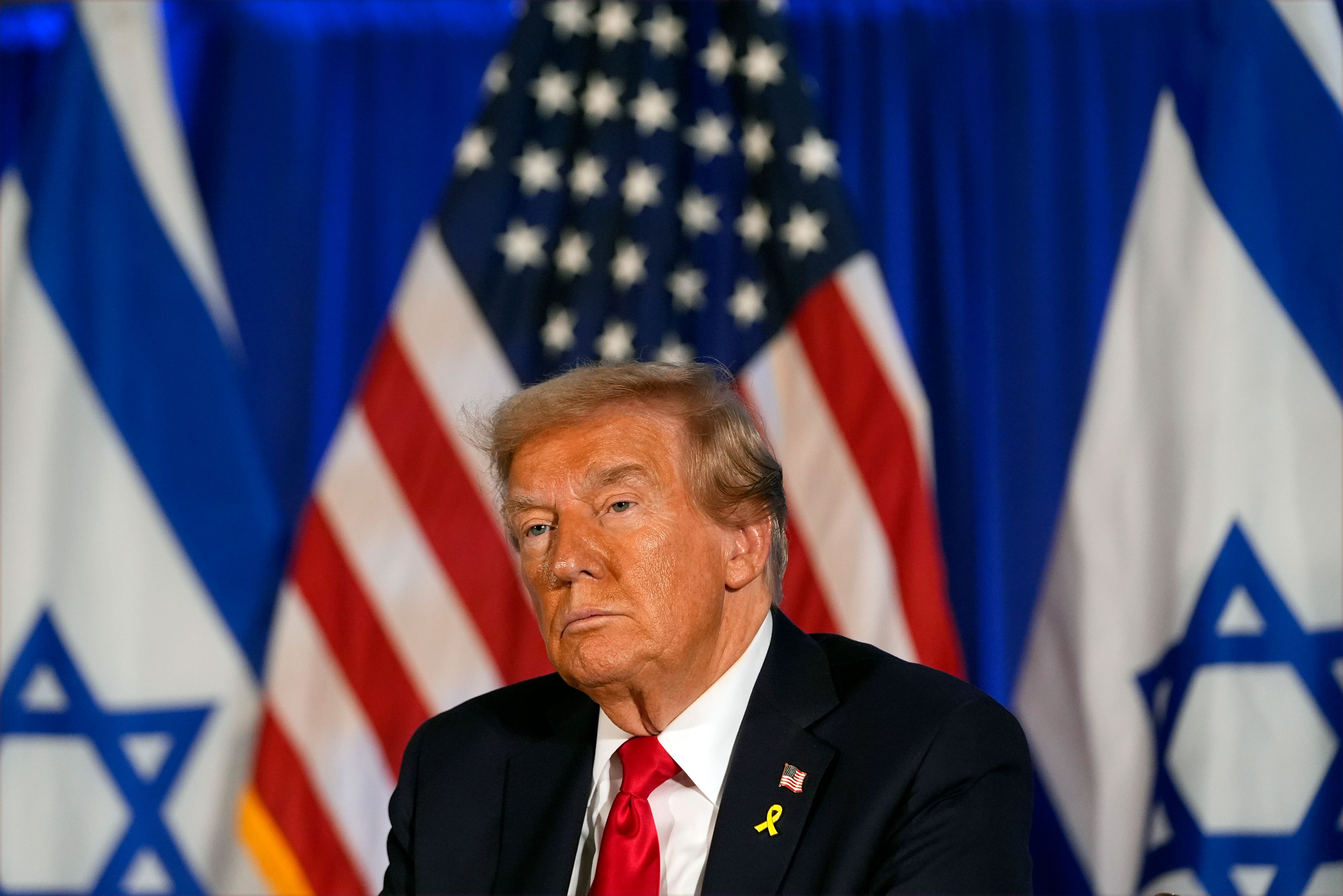 Republican presidential nominee former President Donald Trump listens at an event marking one year since the Oct. 7 Hamas attack on Israel, Monday, Oct. 7, 2024, in Miami. (AP Photo/Alex Brandon)