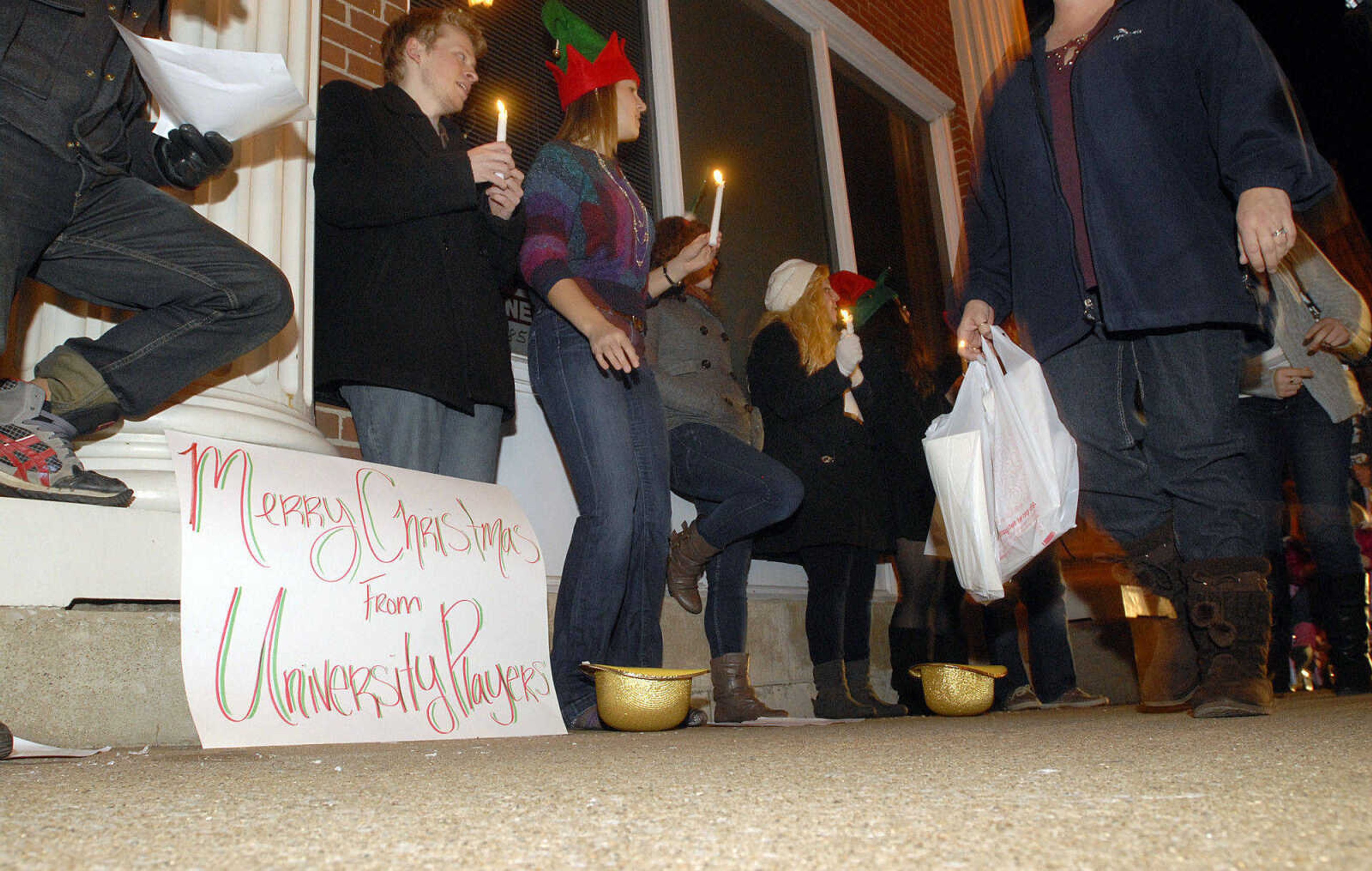 LAURA SIMON ~ lsimon@semissourian.com
The University Players spread holiday cheer on Main Street by singing Christmas carols for all to hear Friday, Dec. 2, 2011 during Old Town Cape's annual Downtown Christmas Open House.