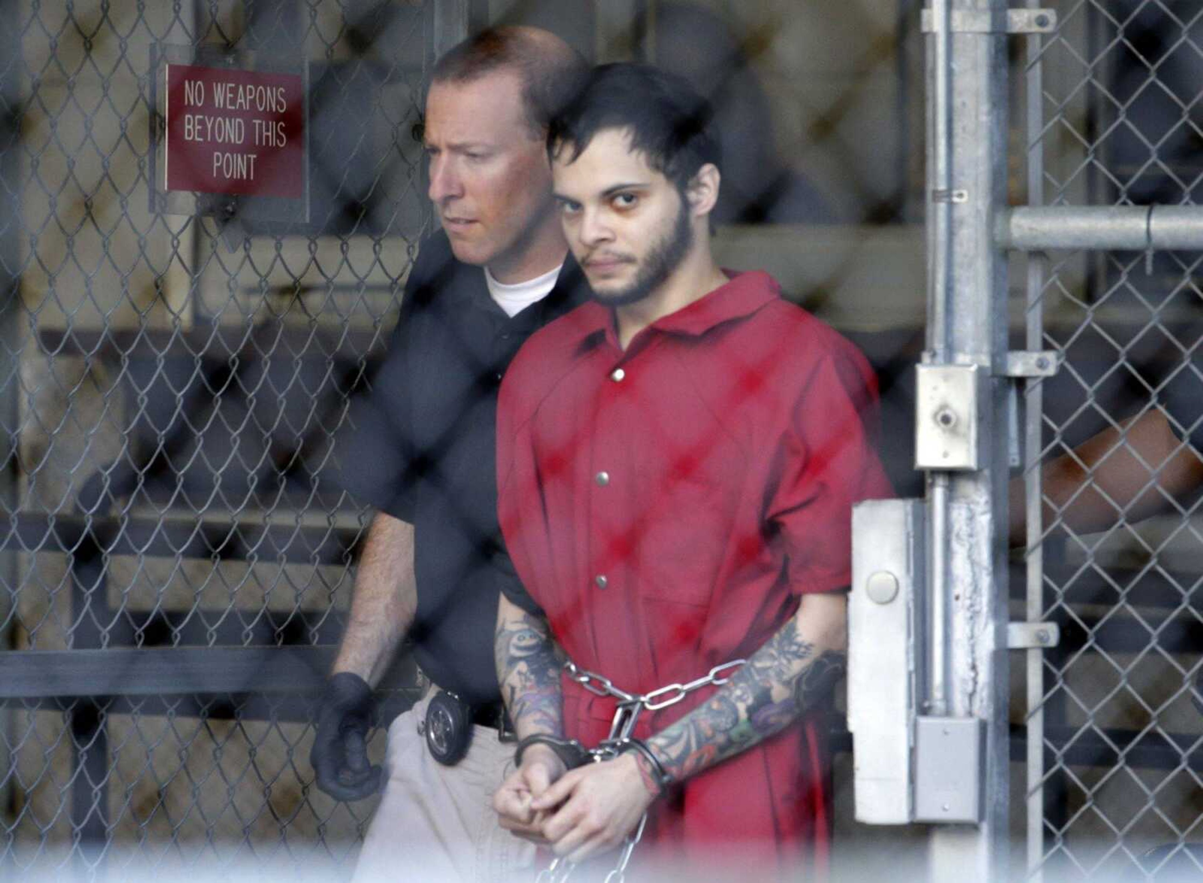 Esteban Santiago leaves the Broward County Jail for a hearing in federal court Tuesday in Fort Lauderdale, Florida.