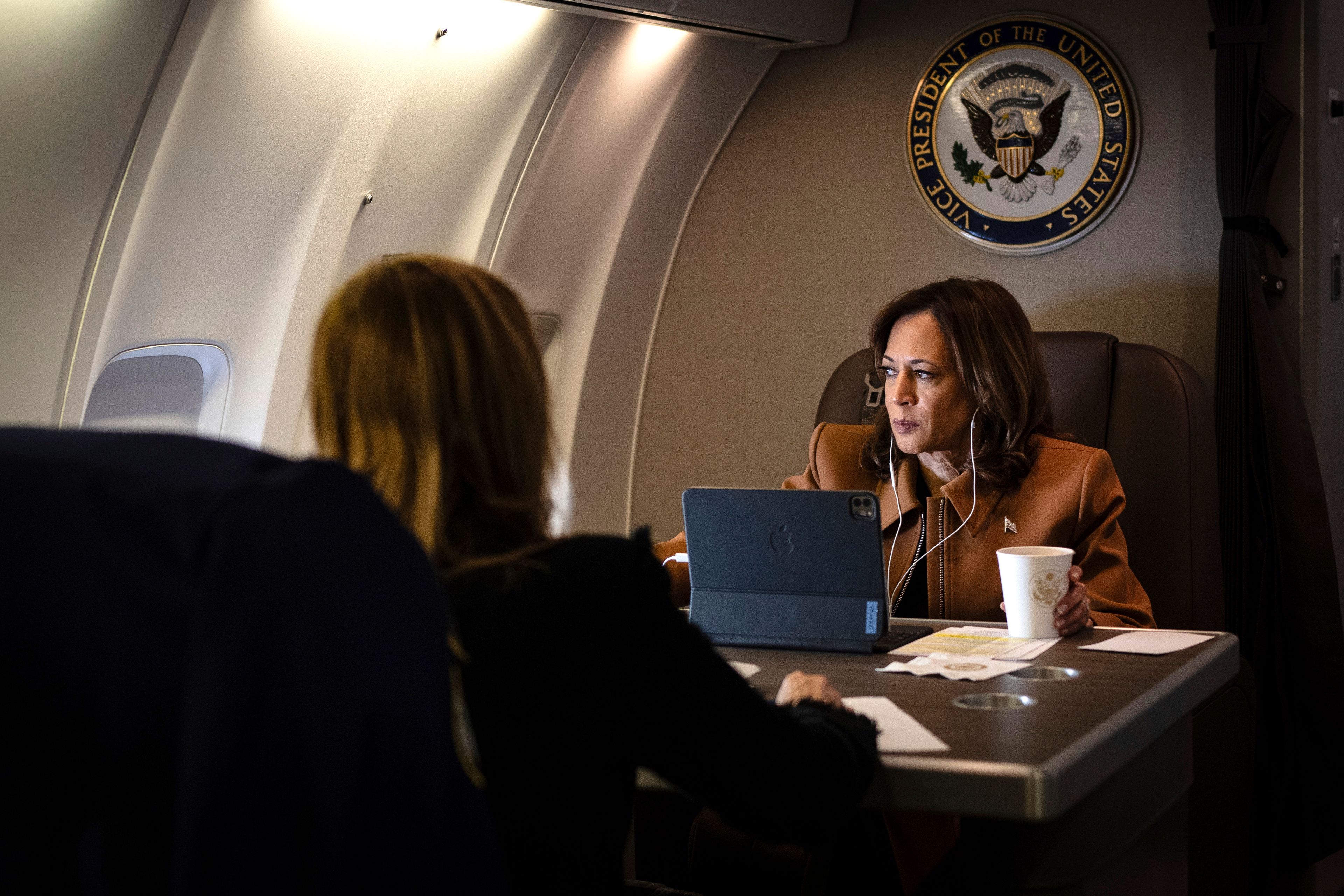 Vice President Kamala Harris works aboard Air Force Two while on a call en route from Houston, TX to Kalamazoo, MI on October 26, 2024. Photography by Erin Schaff/The New York Times.