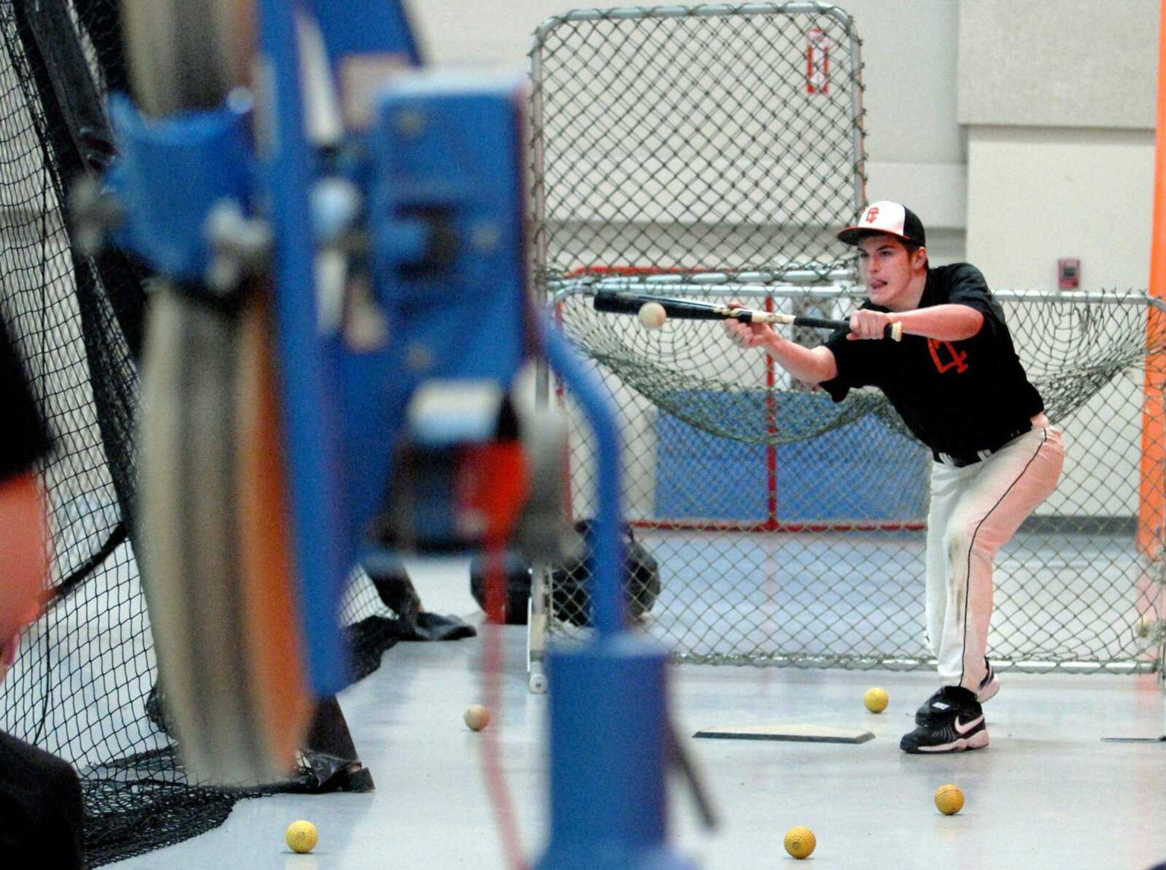 Central freshman Chase Hagerty bunts Saturday during the baseball team's Bunt-a-thon at the high school. Hagerty connected 94 out of 100 balls. (Laura Simon)