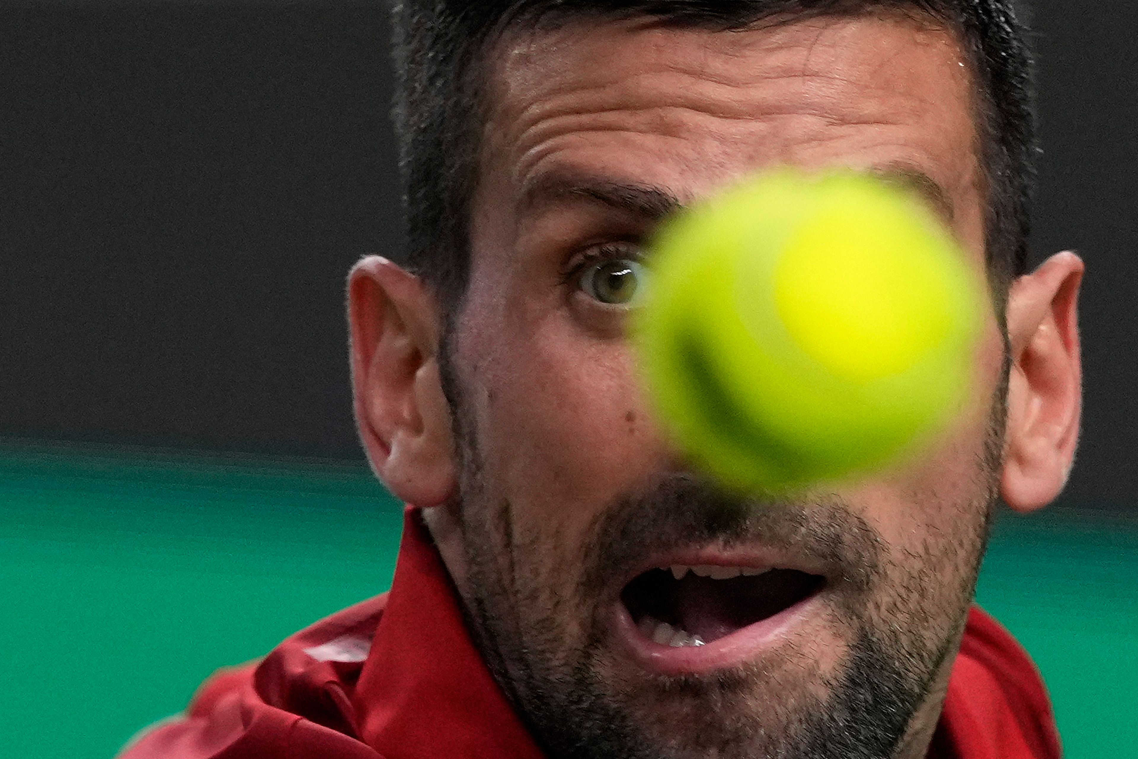 Novak Djokovic of Serbia eyes on the ball during the men's singles semifinals match against Taylor Fritz of the United States in the Shanghai Masters tennis tournament at Qizhong Forest Sports City Tennis Center in Shanghai, China, Saturday, Oct. 12, 2024. (AP Photo/Andy Wong)