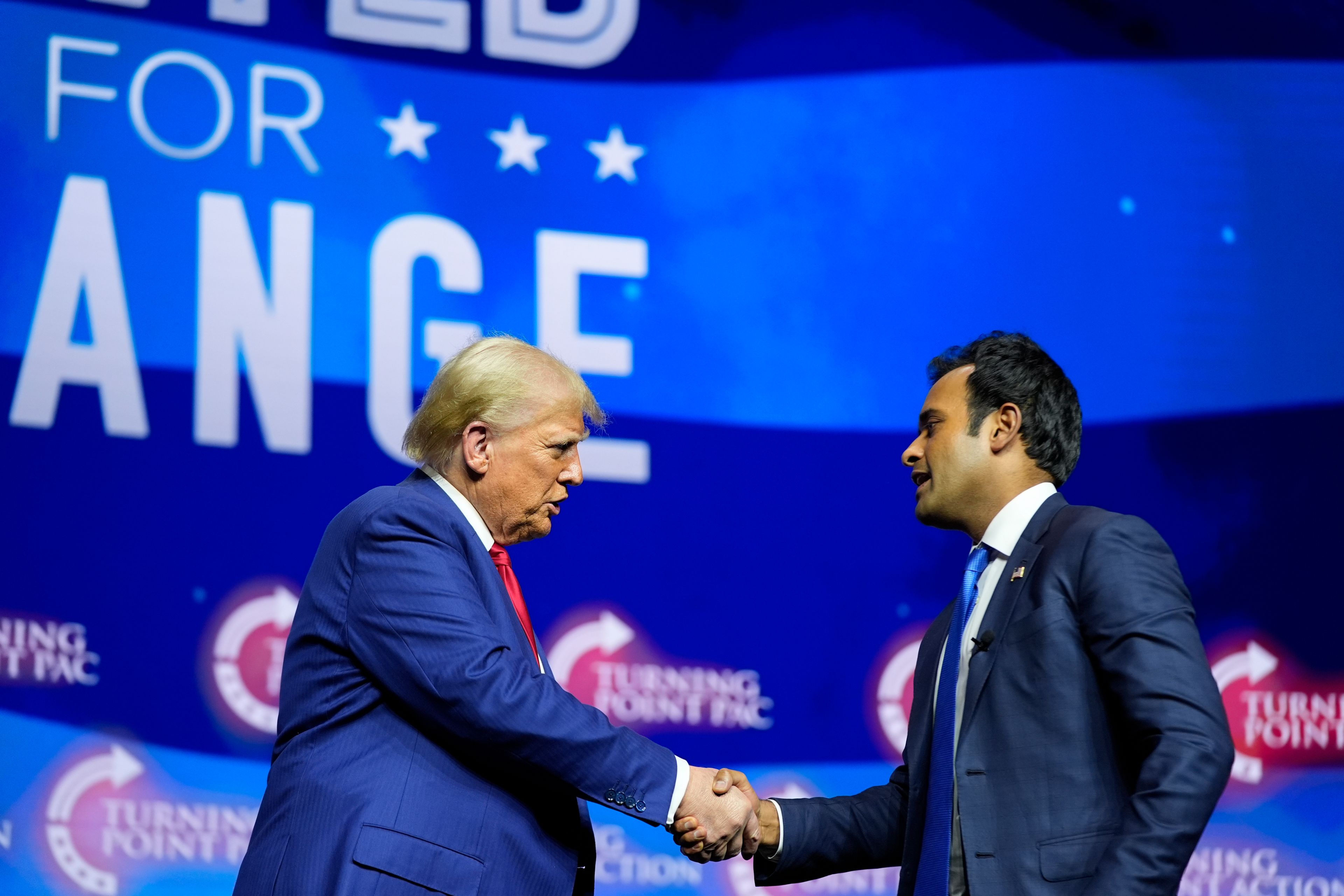 Republican presidential nominee former President Donald Trump shakes hands with Vivek Ramaswamy during a campaign rally at Thomas & Mack Center, Thursday, Oct. 24, 2024, in Las Vegas. (AP Photo/Alex Brandon)