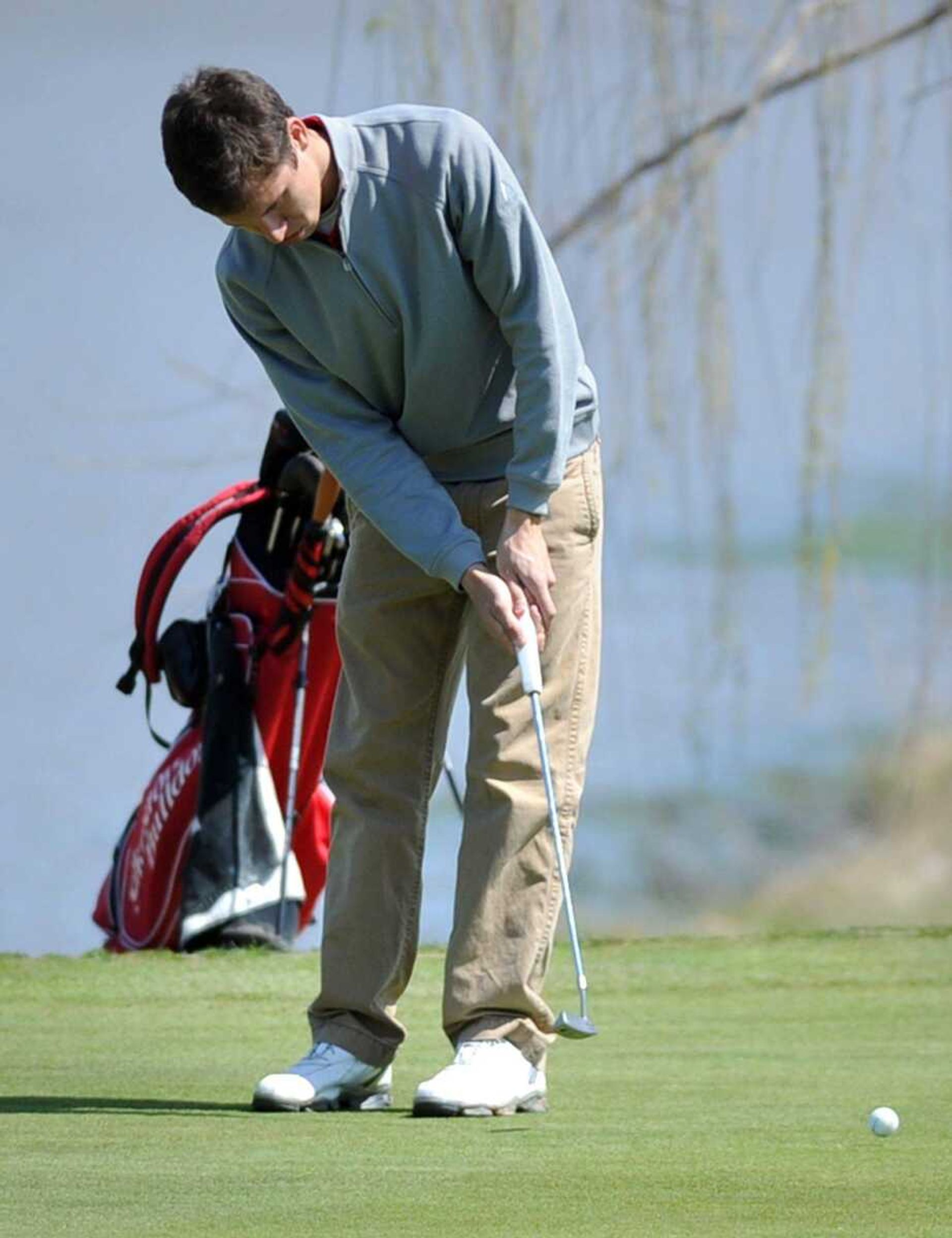 Jackson&#8217;s Eli Pike putts on the sixth green Monday during the Notre Dame Invitational at Bent Creek Golf Course in Jackson. (Laura Simon)