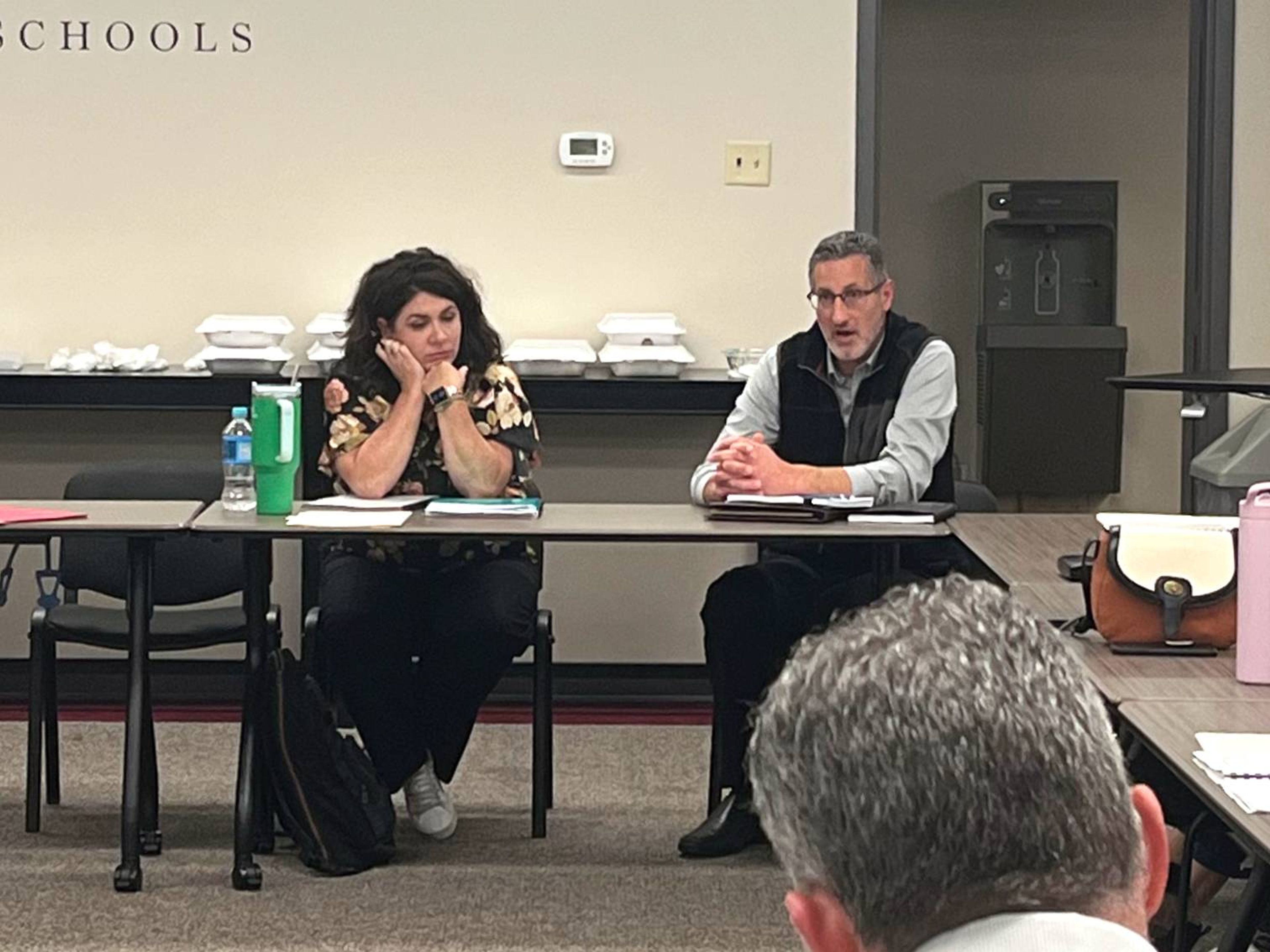 Cape Girardeau Public Schools' chief financial officer Lindsay Dudek, left, listens as certified public accountant Patrick Kintner discusses the district's annual financial audit during a special meeting of the Board of Education on Monday, Nov. 25, at the Central Administration Offices. 