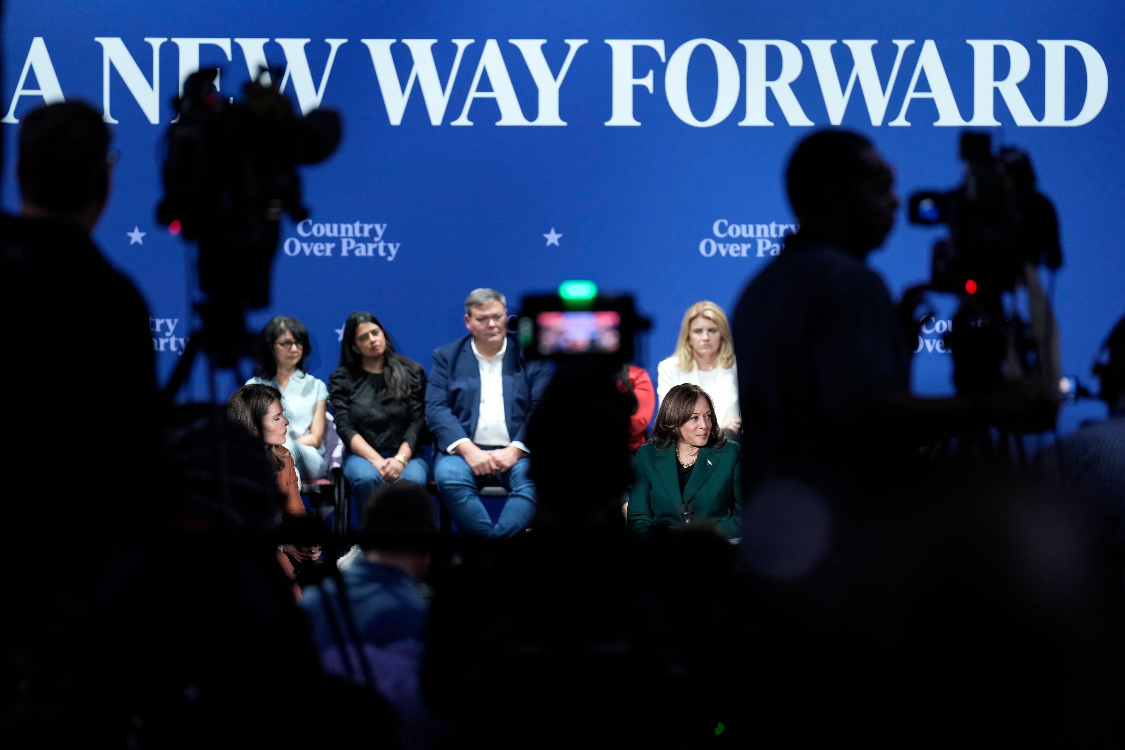 Democratic presidential nominee Vice President Kamala Harris listens as members of the audience look on during a town hall at the Royal Oak Theatre in Royal Oak, Mich., Monday, Oct. 21, 2024. (AP Photo/Jacquelyn Martin)