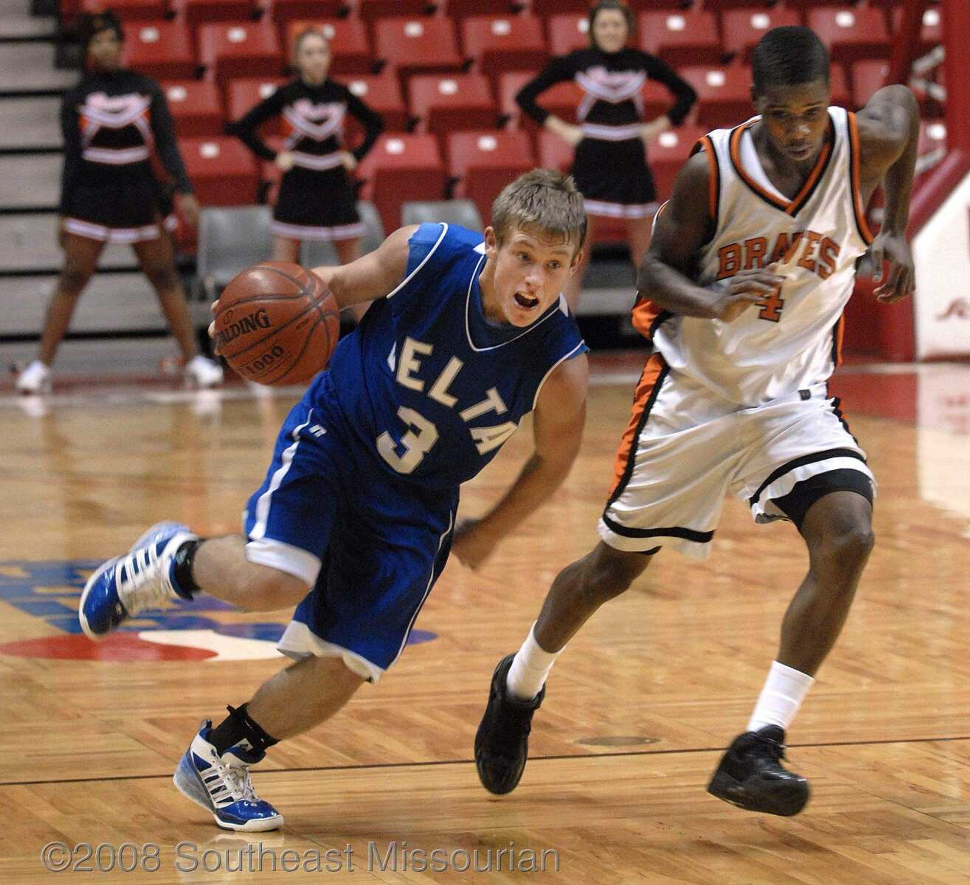 FRED LYNCH ~ flynch@semissourian.com
Delta's Teddy May drives against Scott County Central's Bobby Hatchet in the third quarter of their first-round game in the Southeast Missourian Christmas Tournament Friday at the Show Me Center.