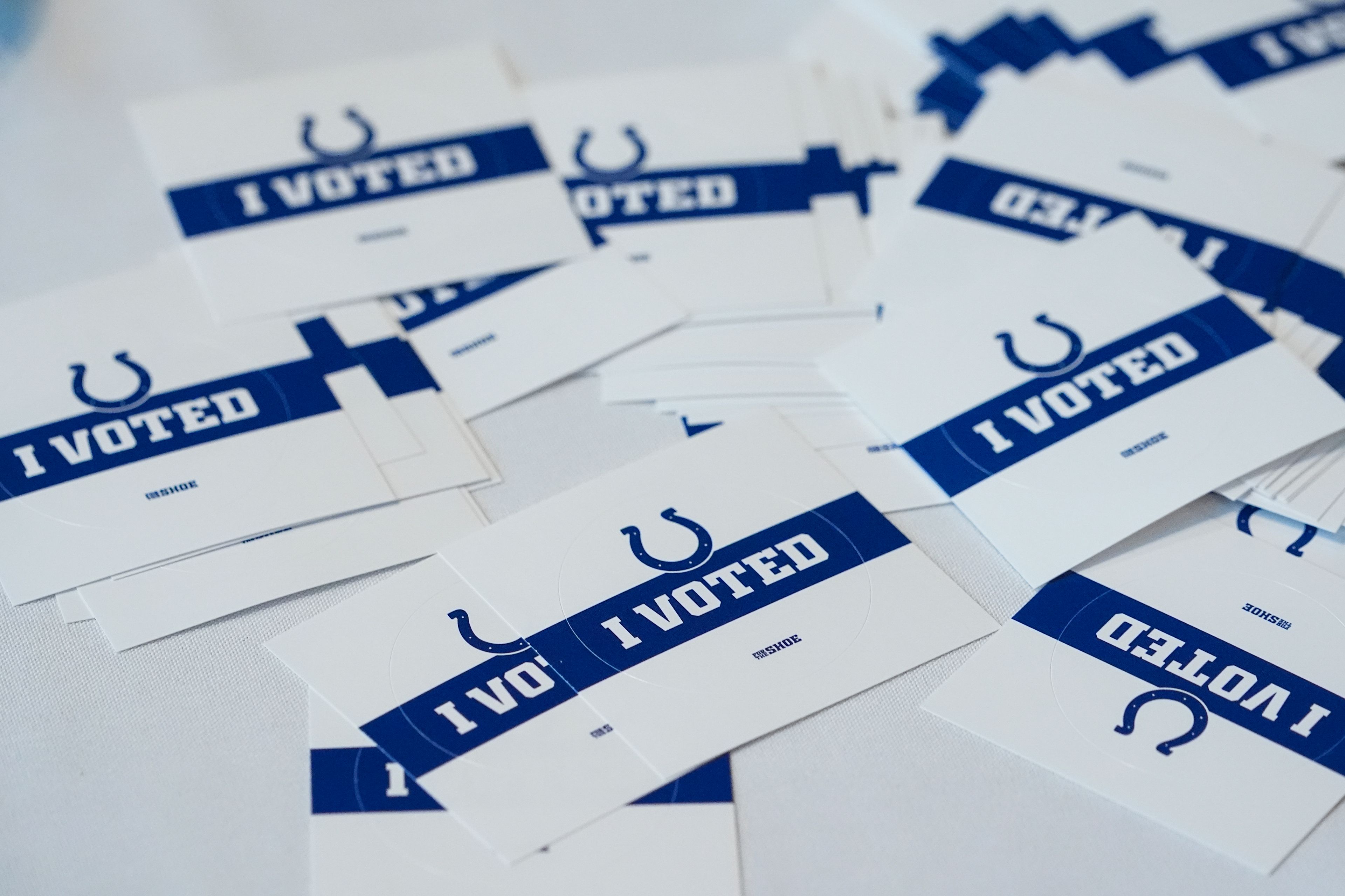 "I Voted" stickers featuring the logo of the Indianapolis Colts are given to voters at a polling location inside the Lucas Oil Stadium, home of the Colts, in Indianapolis, Tuesday, Nov. 5, 2024. (AP Photo/Michael Conroy)