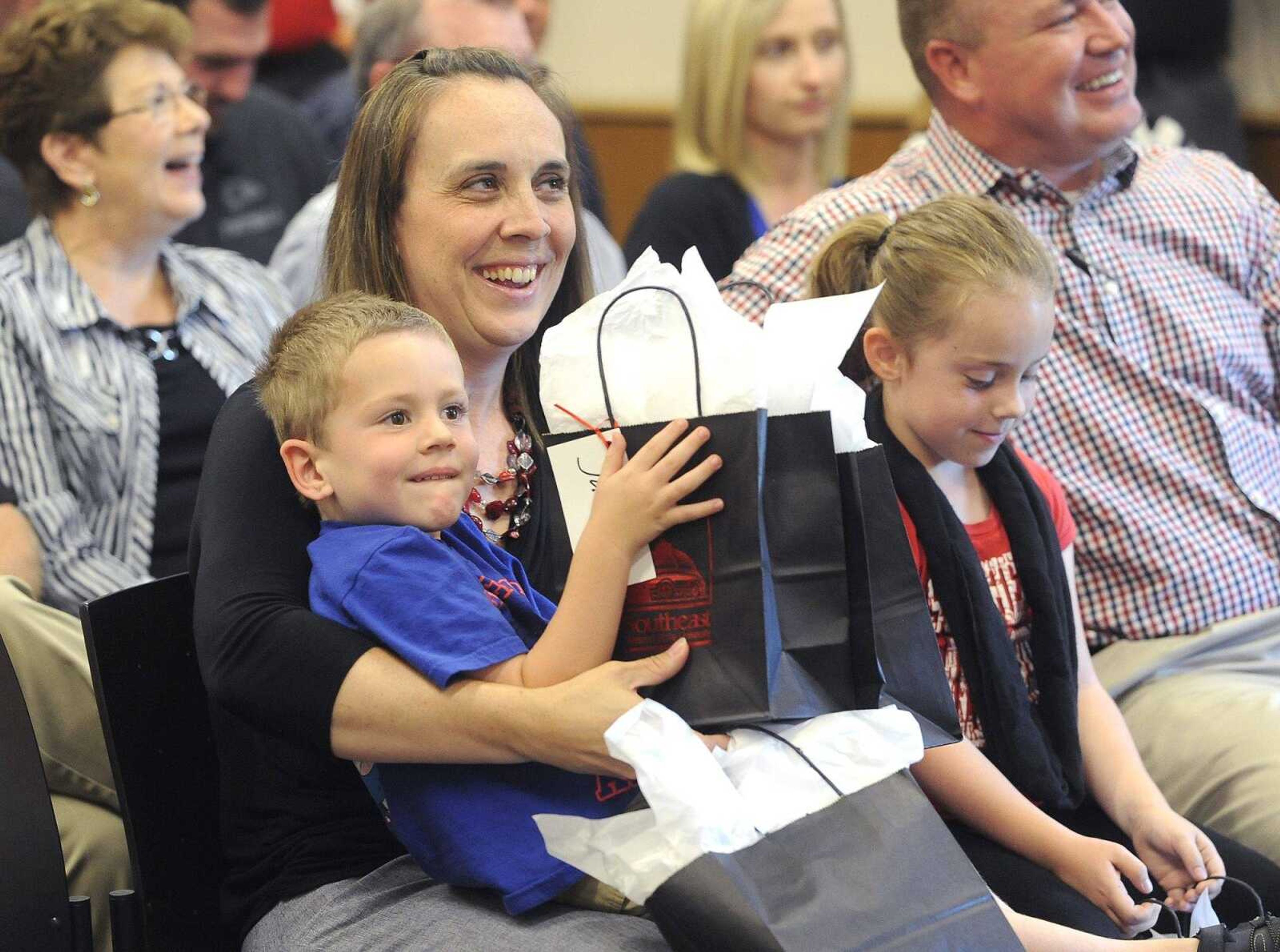 Halley Barke and children, Jackson and Mabrie, received gifts after Brady Barke was named Southeast Missouri State's athletic director at Tuesday's news conference.