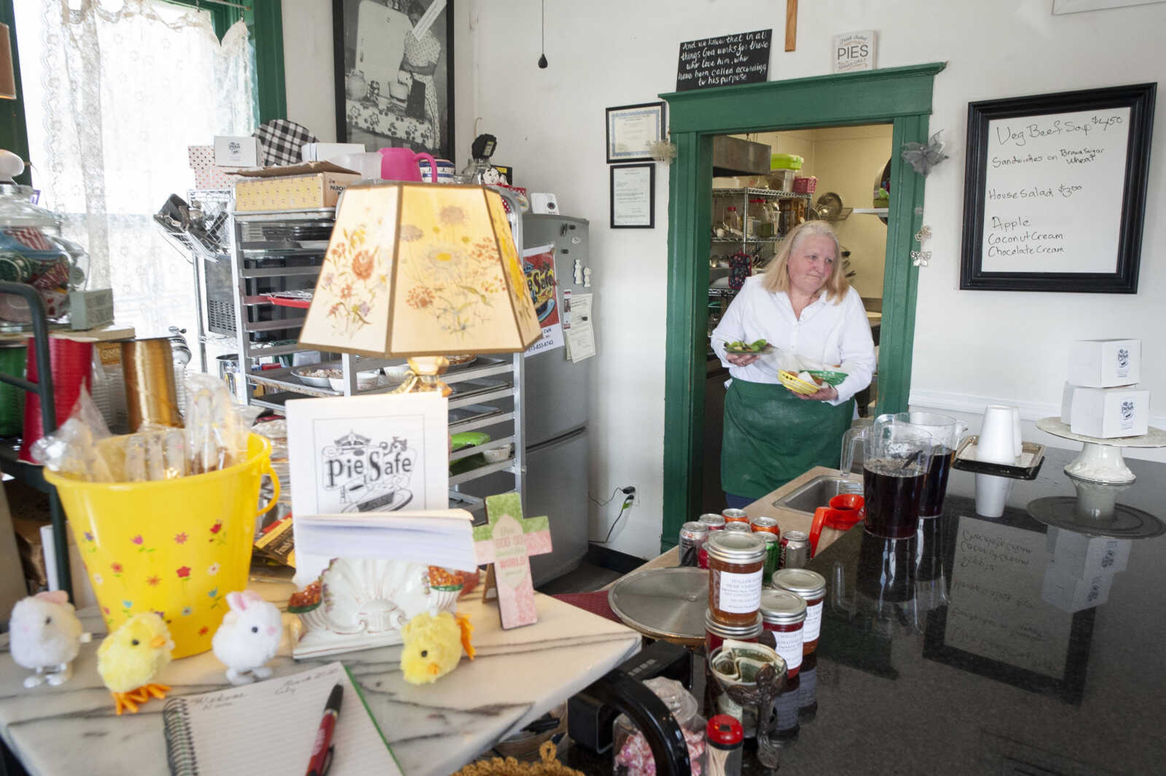 Sharon Penrod takes meals to customers Wednesday, March 11, 2020, at The Pie Safe Bakery & Cafe in Pocahontas.