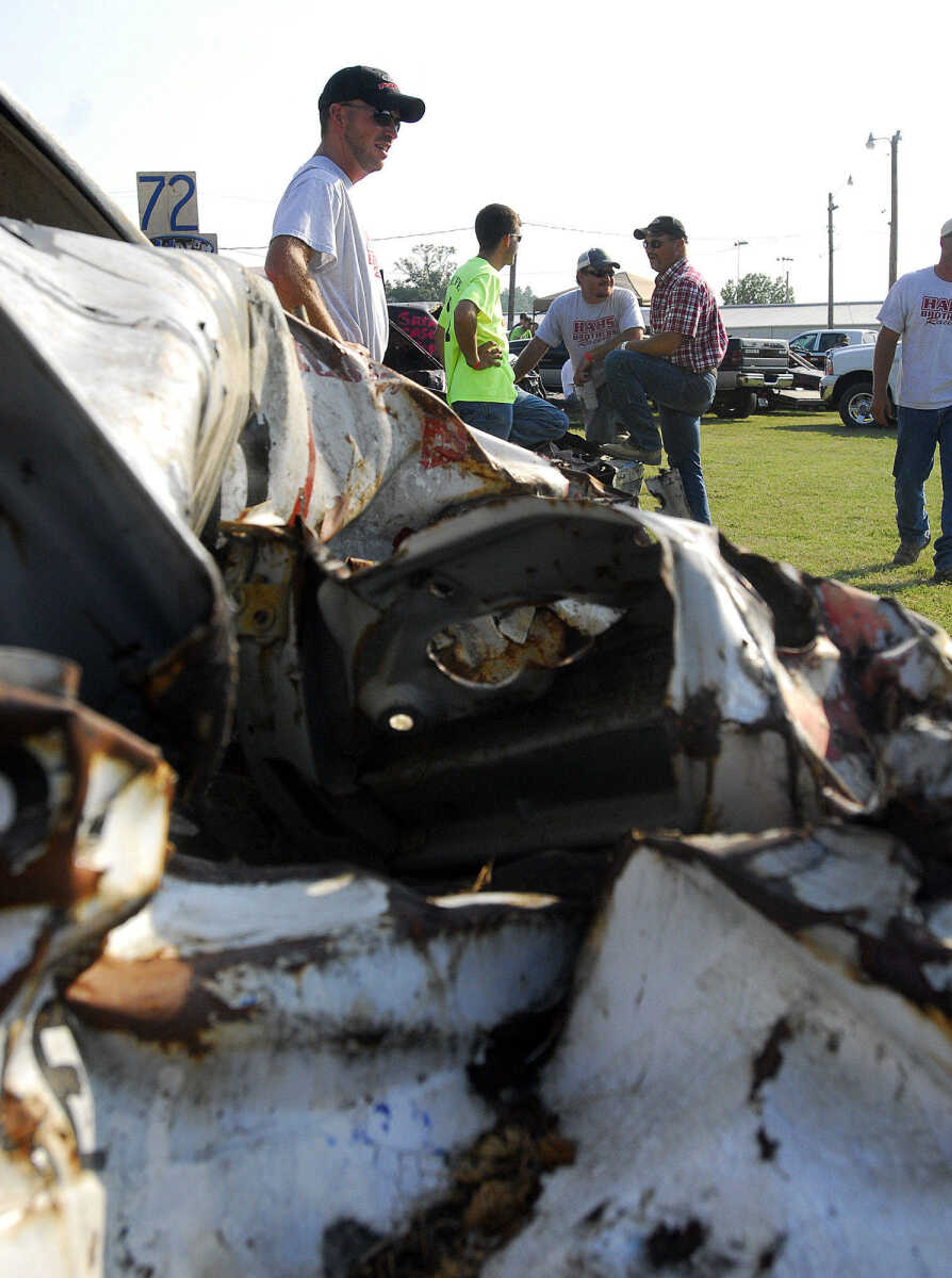 LAURA SIMON~lsimon@semissourian.com
From left, Brian Hautt, Dustin Kaempfe, Adam Meyer, and Kenny Kester wait for the Dual Demolition Derby to begin during the U.S.A. Veterans Fourth of July celebration at Arena Park in Cape Girardeau Sunday, July 4, 2010.