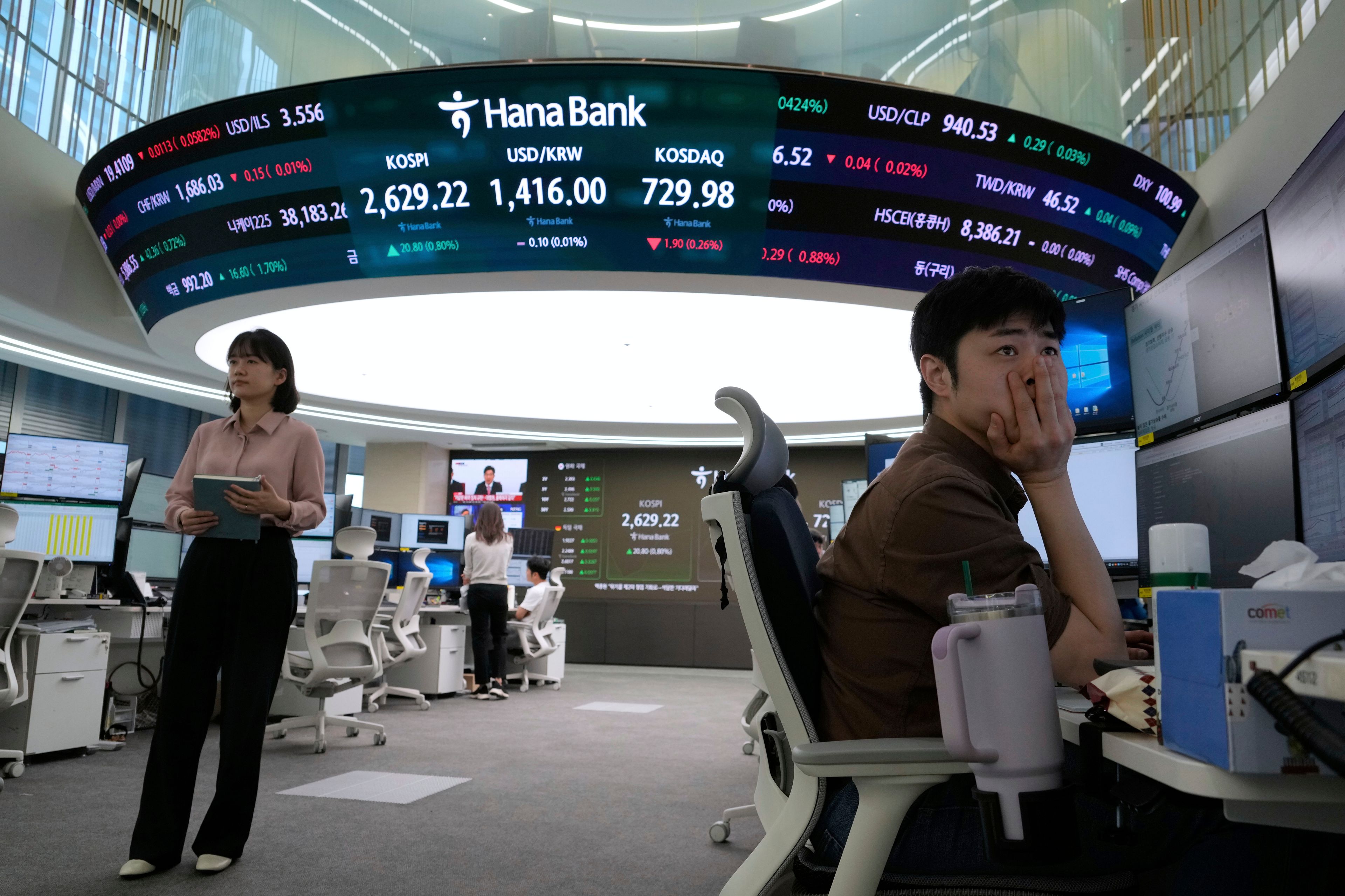 Asian shares mostly gain amid cautious relief over U.S.-China agreement