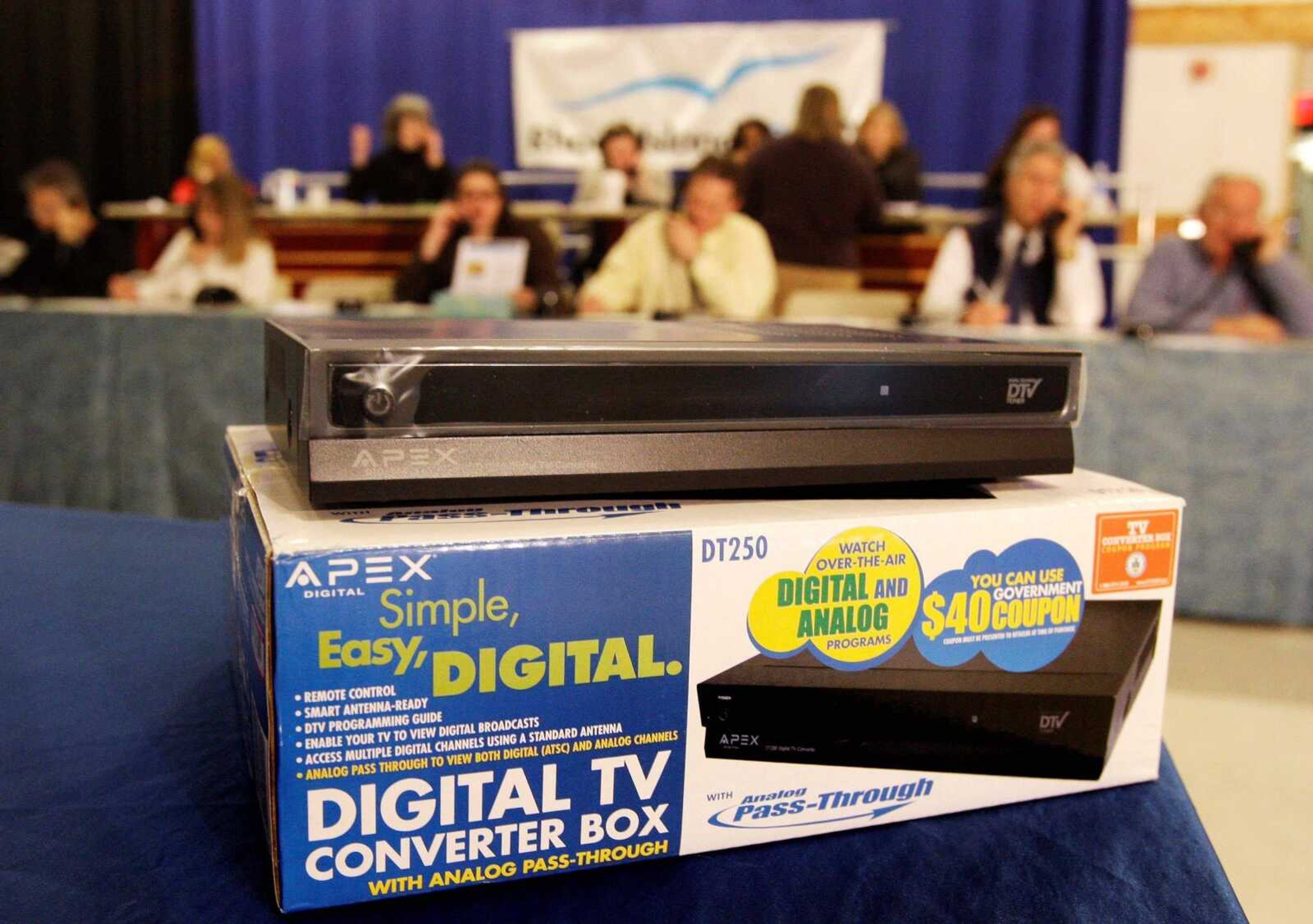 Charles Krupa ~ Associated Press<br>A digital television converter box is displayed Tuesday at a digital switch information call center at a public television studio in Providence, R.I. The center spent the day fielding calls from viewers facing problems with the end of analog signals.