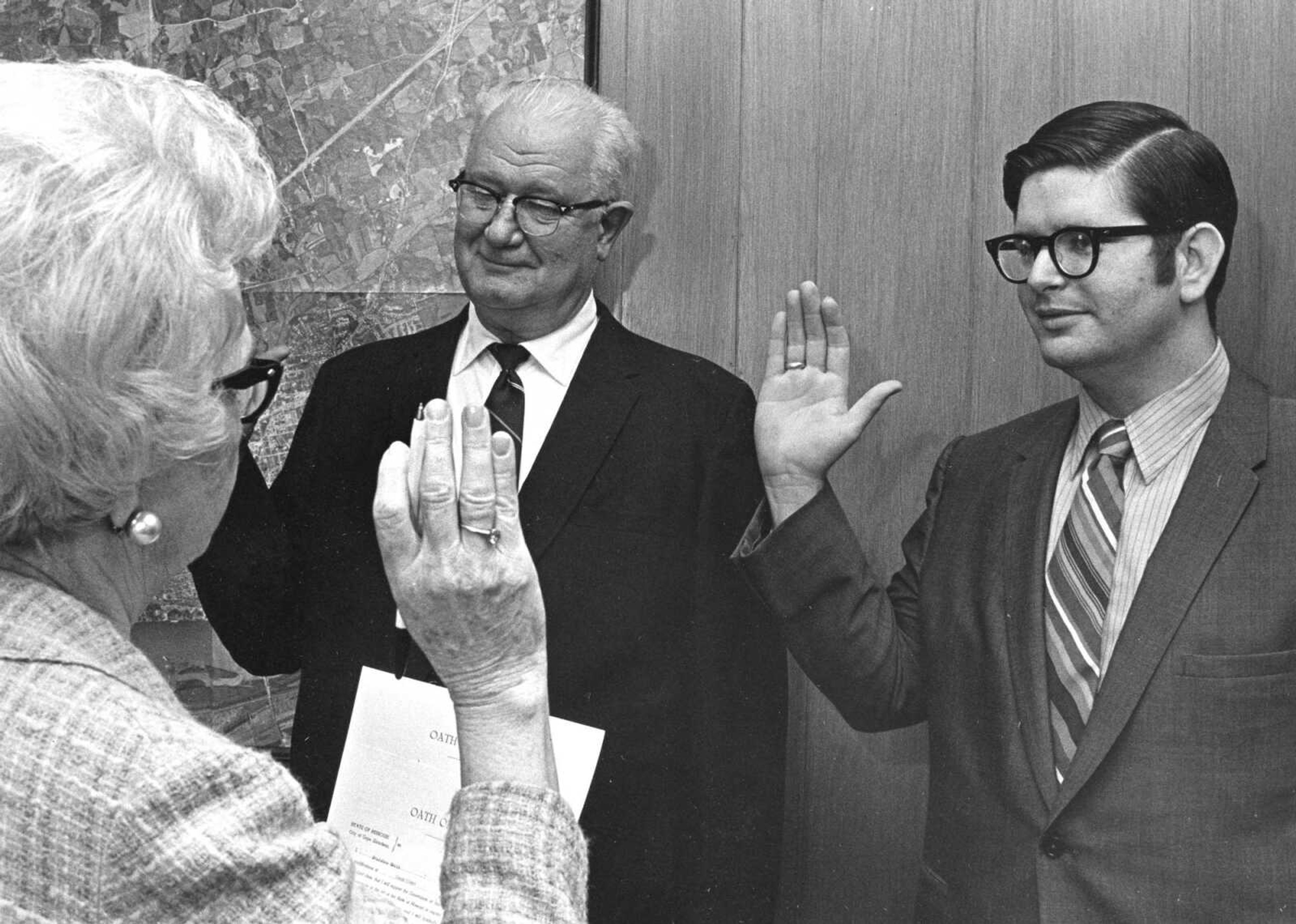 Published April 12, 1971.
Two new members of the Cape Girardeau City Council, Oliver A. Hope, left, and Bradshaw Smith, were administered the oath of office by Verna L. Landis, city clerk. (Southeast Missourian archive)