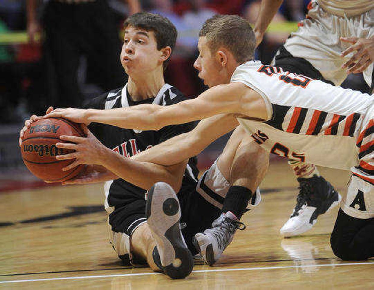 Bell City's Cole Nichols tries to keep the ball from Advance's Preston Wuebker during the first quarter in a first-round game of the Southeast Missourian Christmas Tournament Saturday, Dec. 26, 2015 at the Show Me Center. (FRED LYNCH)